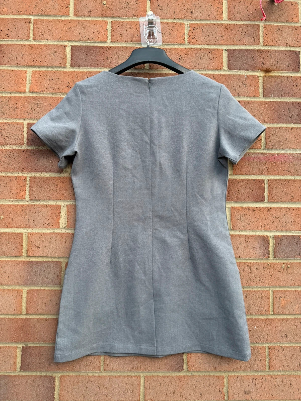 Simon Jersey grey bodycon mini dress with cut-out details, chic office style.