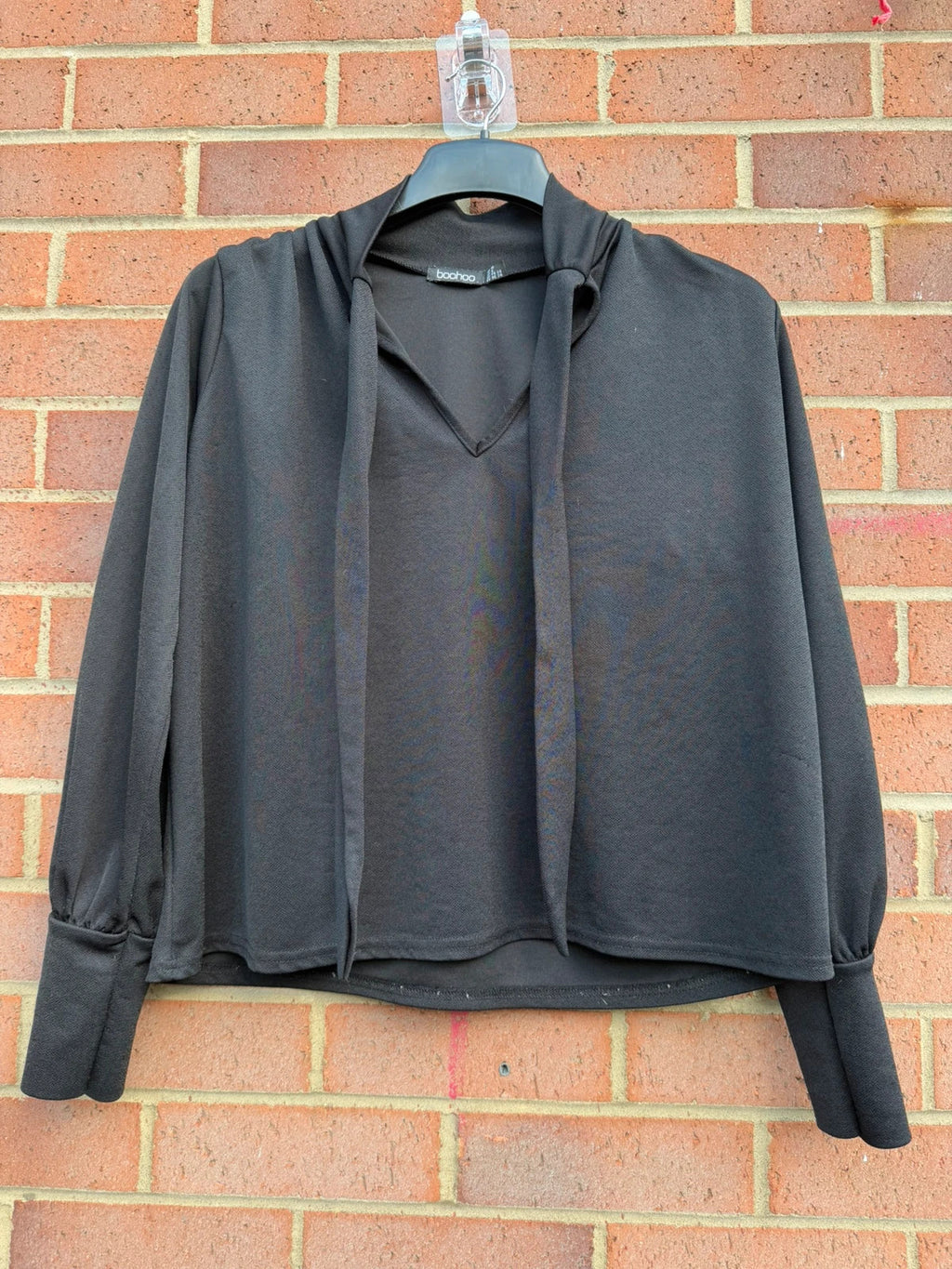 Boohoo black tie neck blouse with long sleeves and elegant office style.