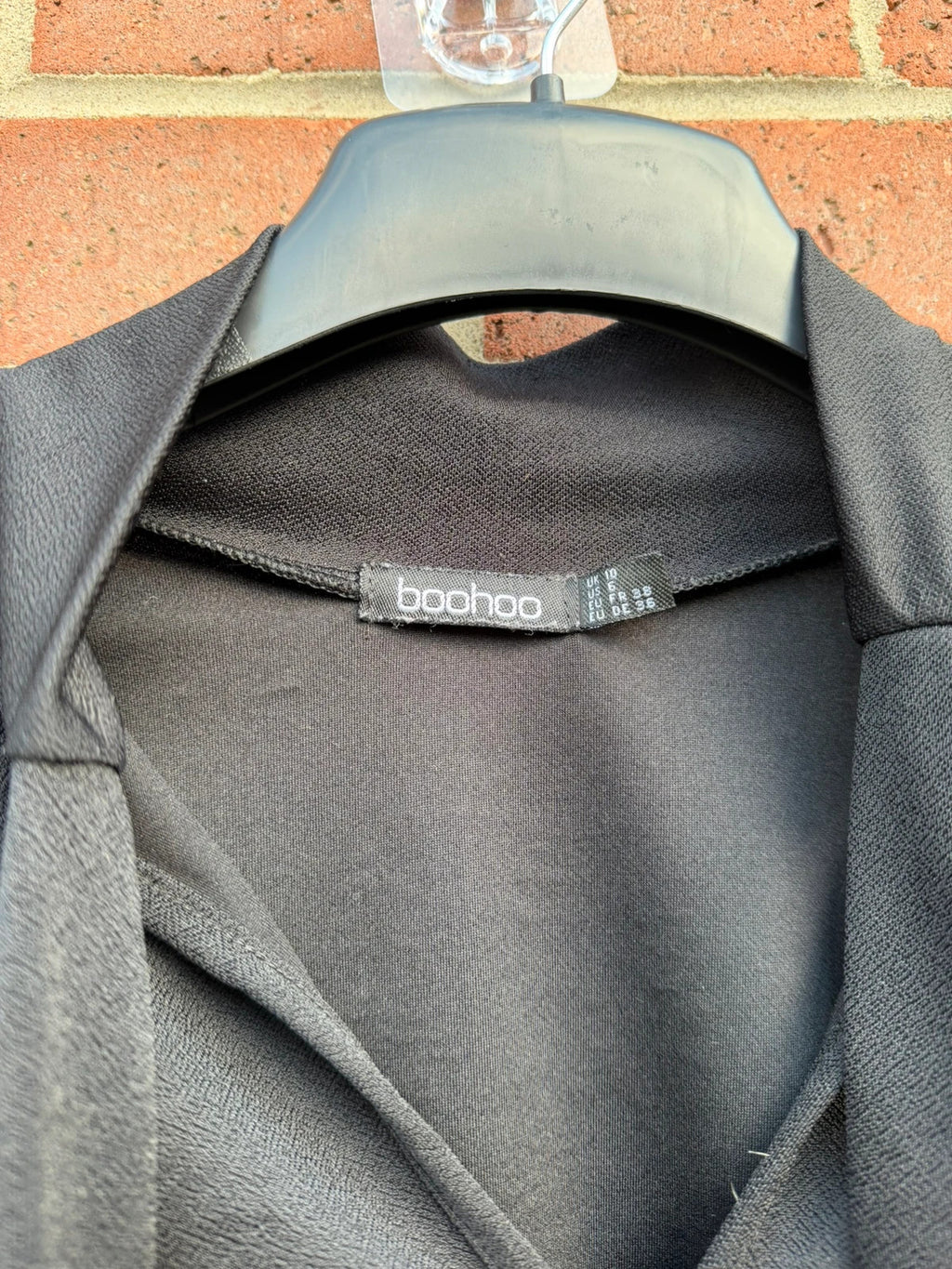Boohoo black tie neck blouse with long sleeves and elegant office style.