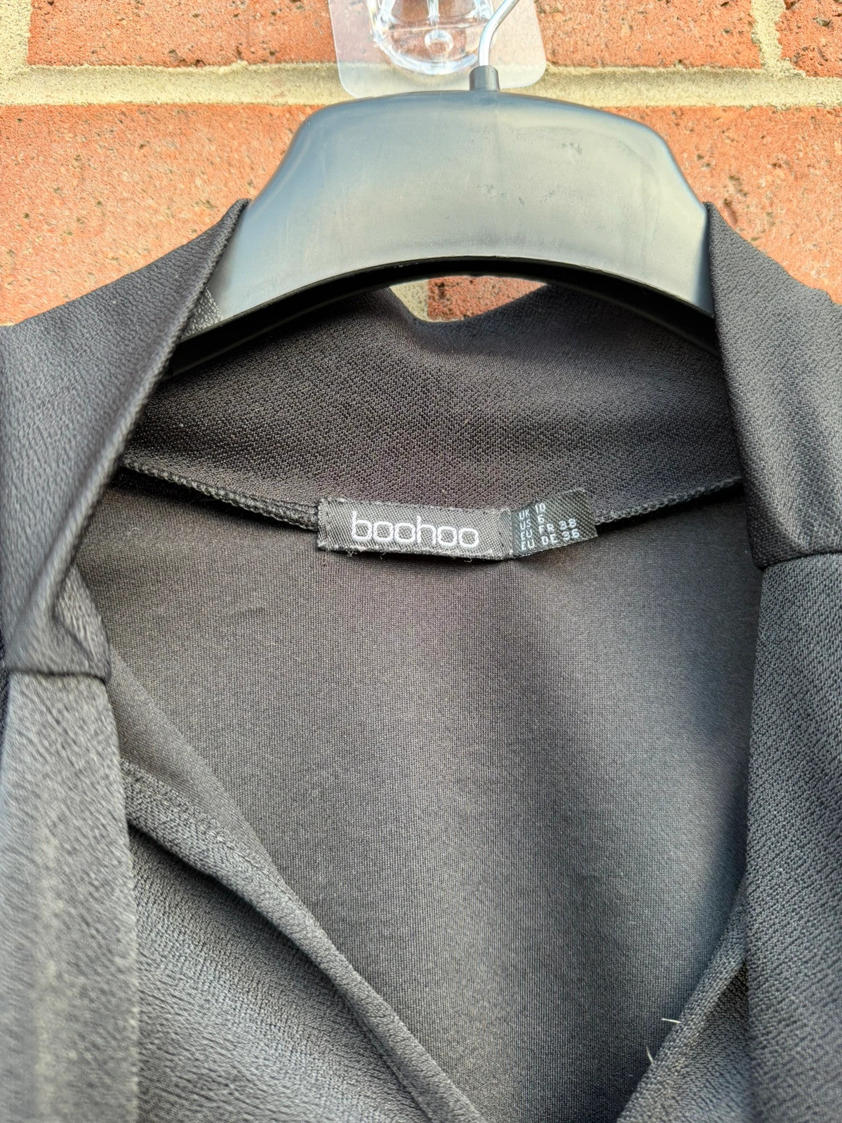 Boohoo black tie neck blouse with long sleeves and elegant office style.