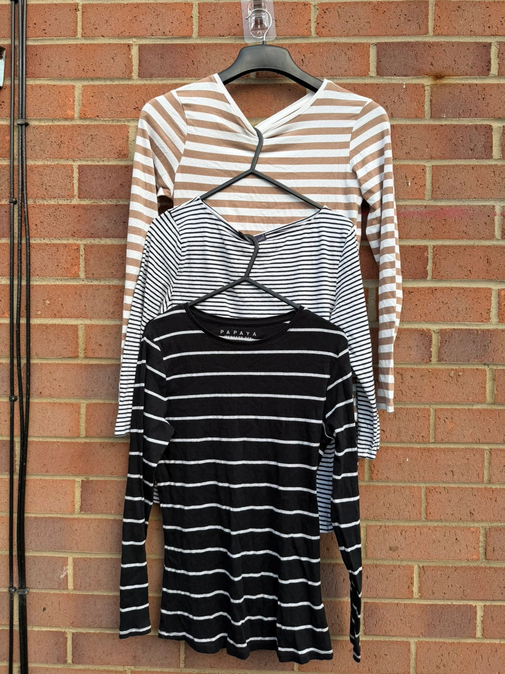 Primark multi-colour tunic blouses with monochrome stripes and soft fabric.