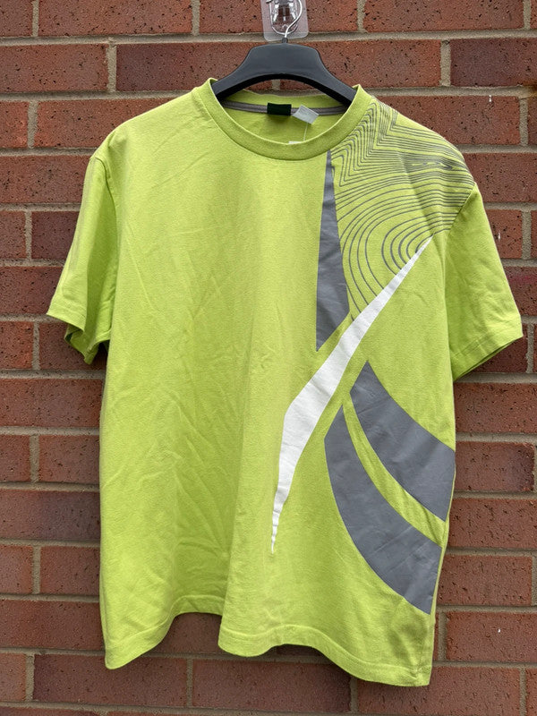 Reebok lime green oversized graphic tee with bold streetwear design and soft fabric.