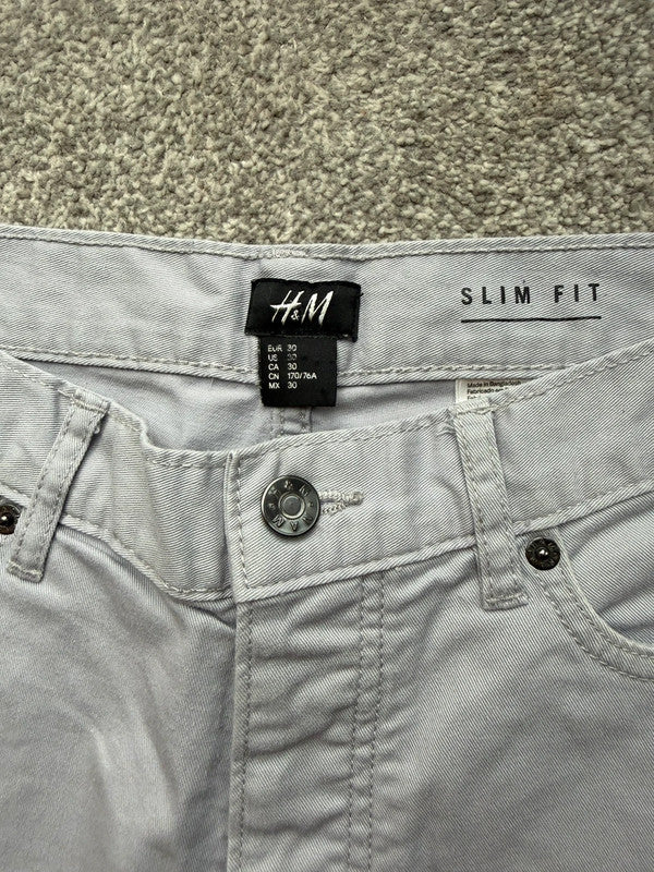 H&M grey chino shorts with stretch fabric and slim fit design.