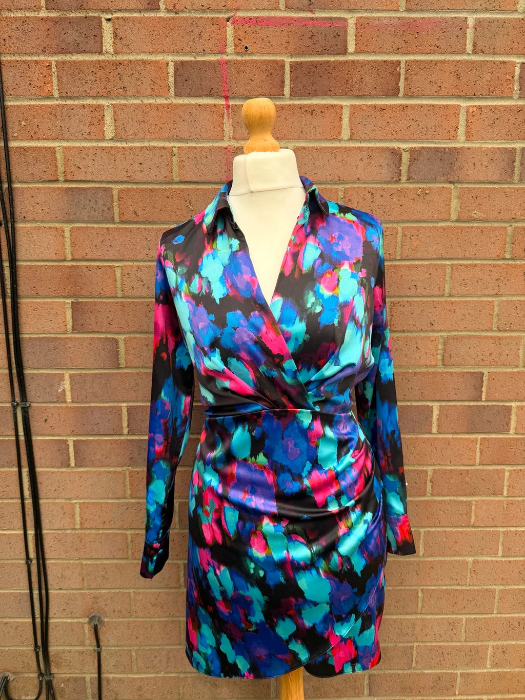 Gallery multi bandage dress with abstract satin pattern and bodycon fit.