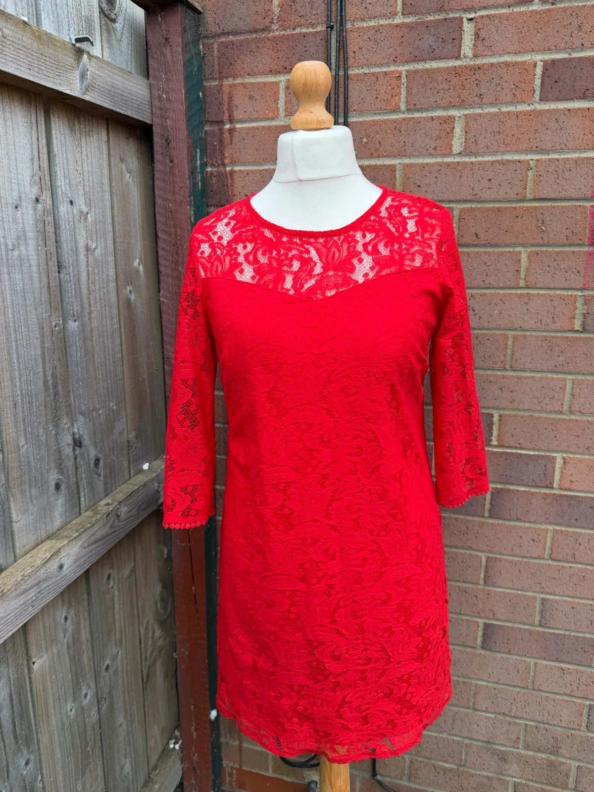Pep&Co red bandage dress with lace detailing, elegant design for evening events.