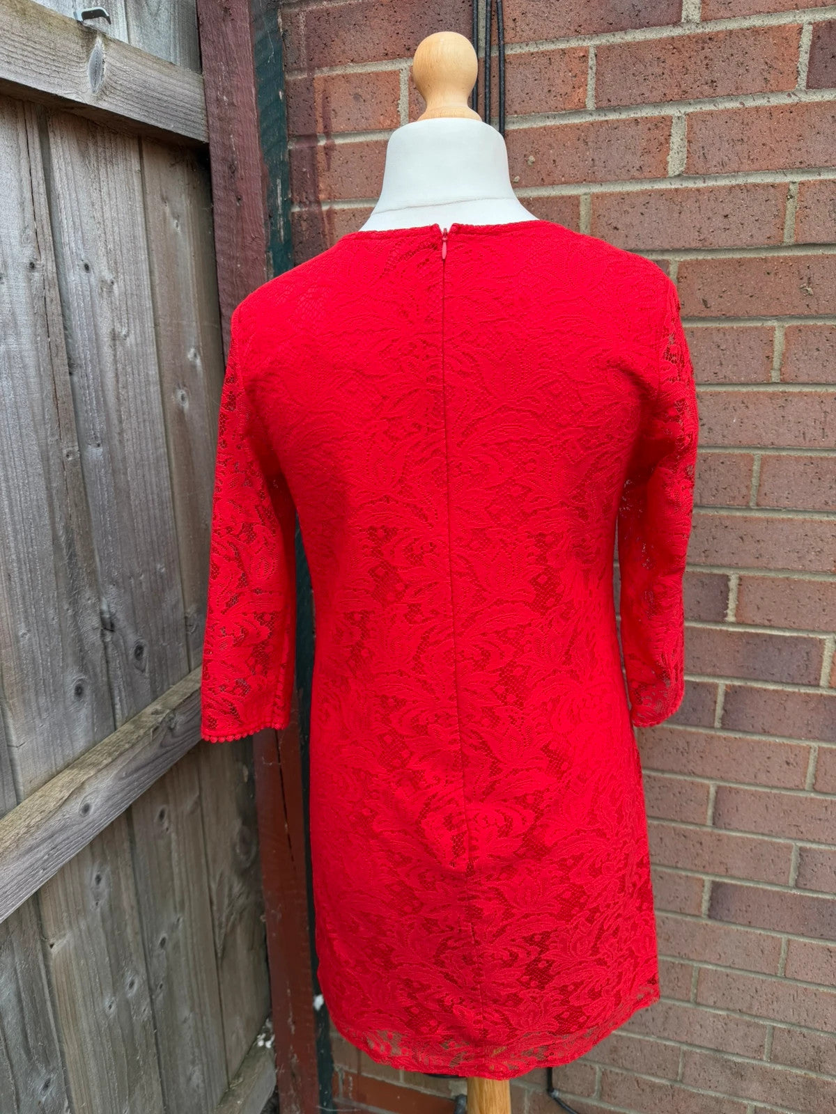 Pep&Co red bandage dress with lace detailing, elegant design for evening events.