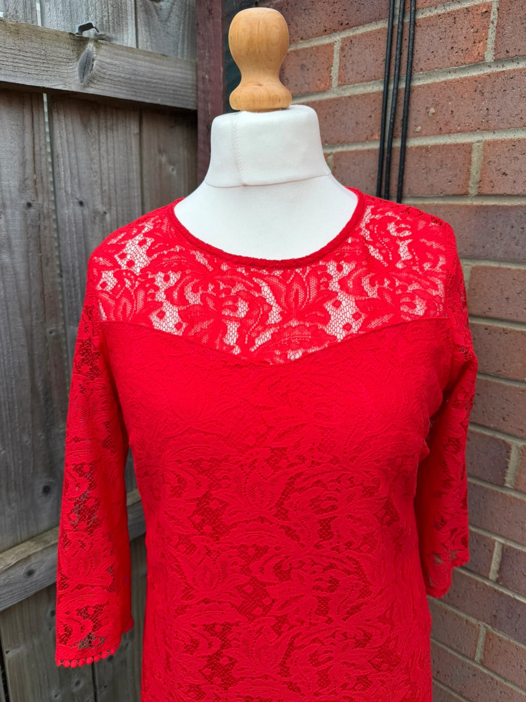 Pep&Co red bandage dress with lace detailing, elegant design for evening events.