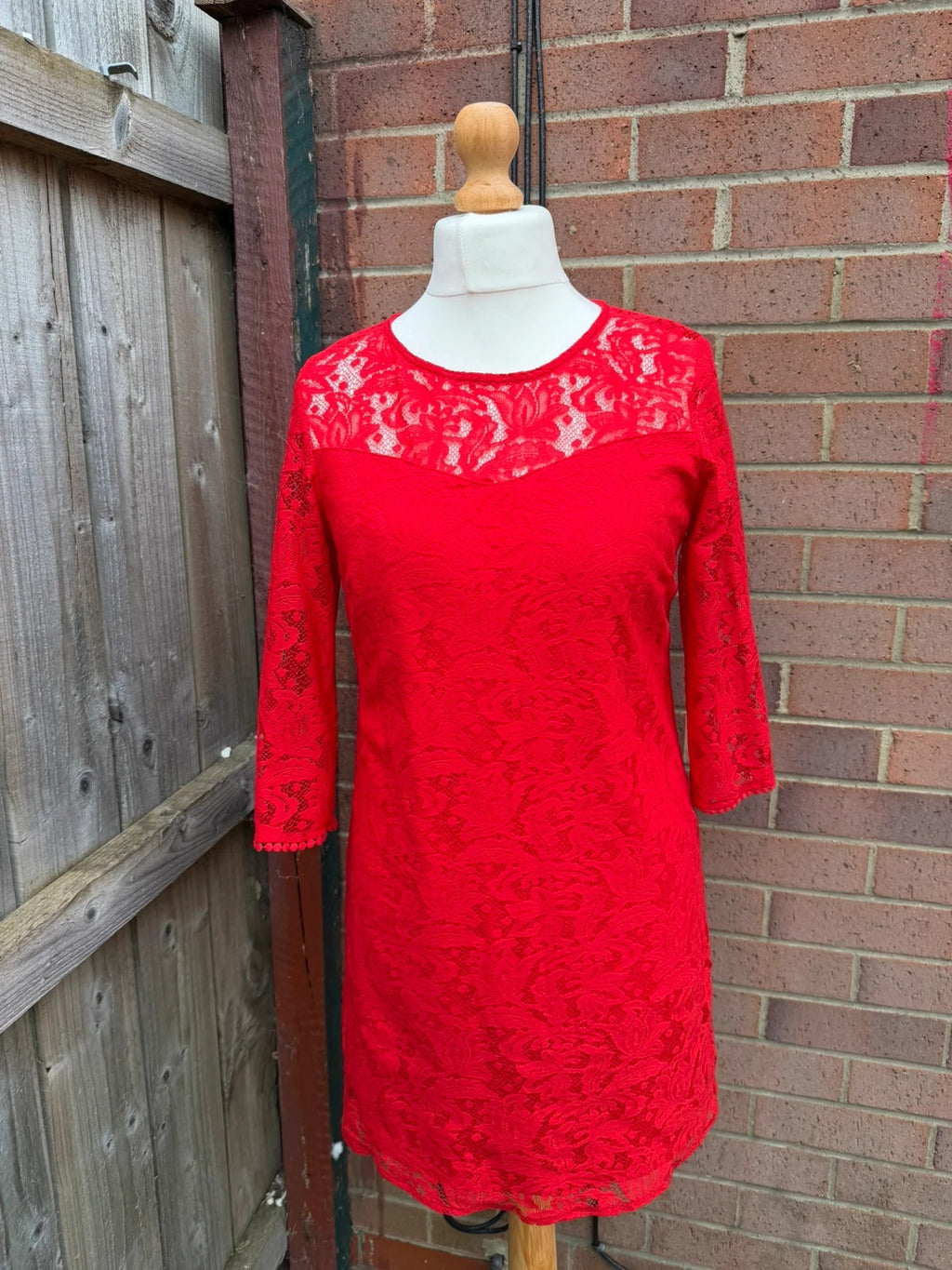 Pep&Co red bandage dress with lace detailing, elegant design for evening events.