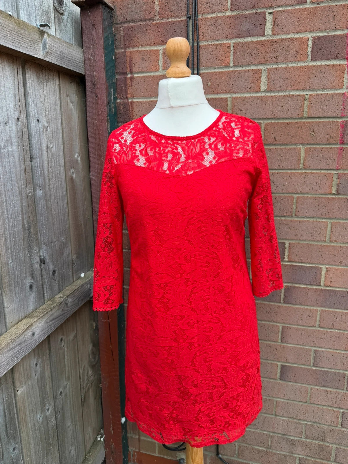 Pep&Co red bandage dress with lace detailing, elegant design for evening events.