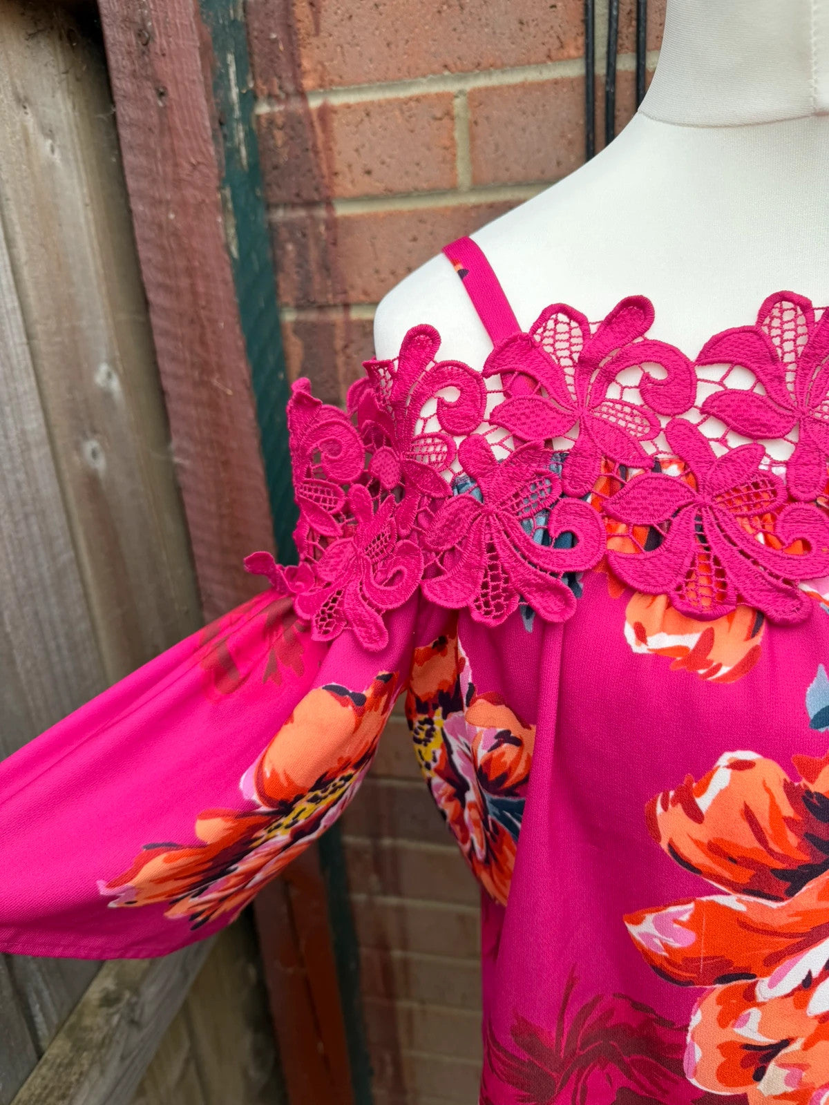 Soon multi off-the-shoulder top with pink floral pattern and lace details.