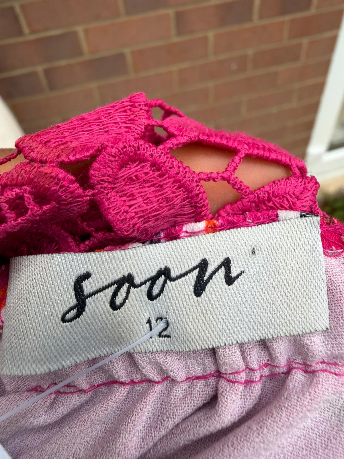 Soon multi off-the-shoulder top with pink floral pattern and lace details.