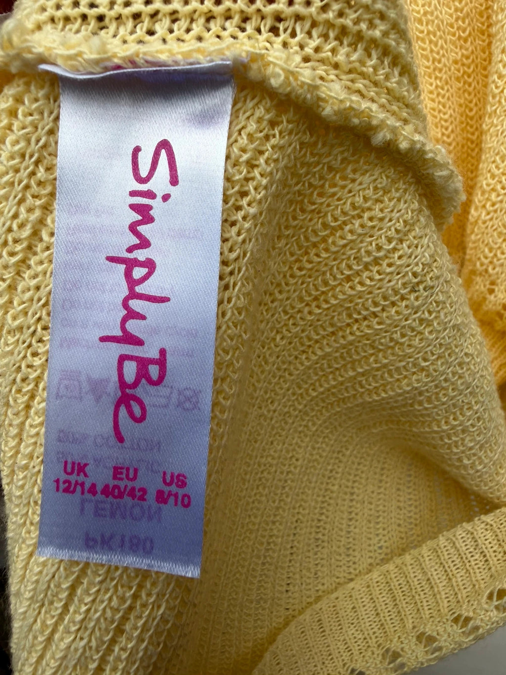 Simply Be yellow knit cropped bolero shrug with tie front detail.