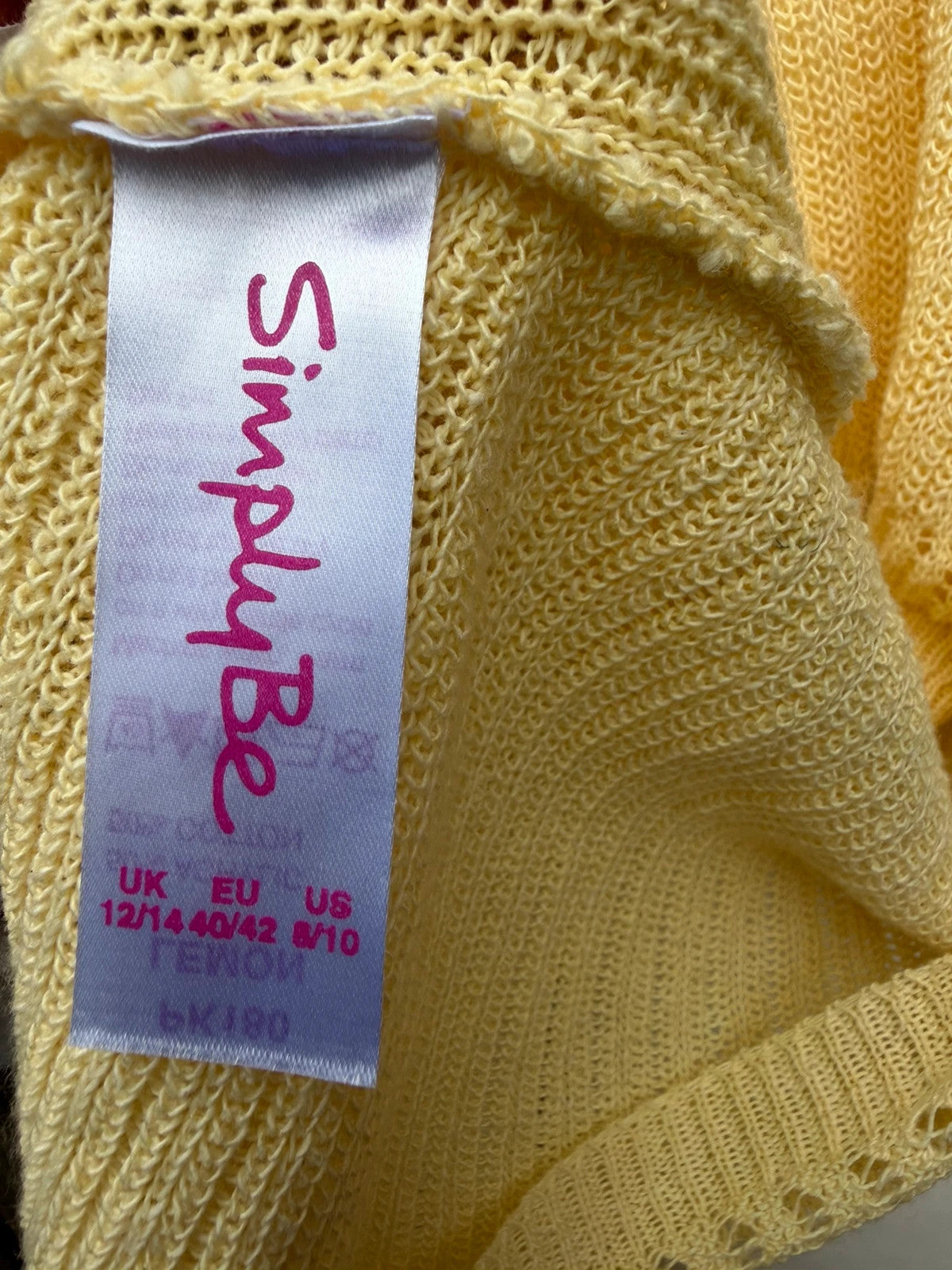 Simply Be yellow knit cropped bolero shrug with tie front detail.