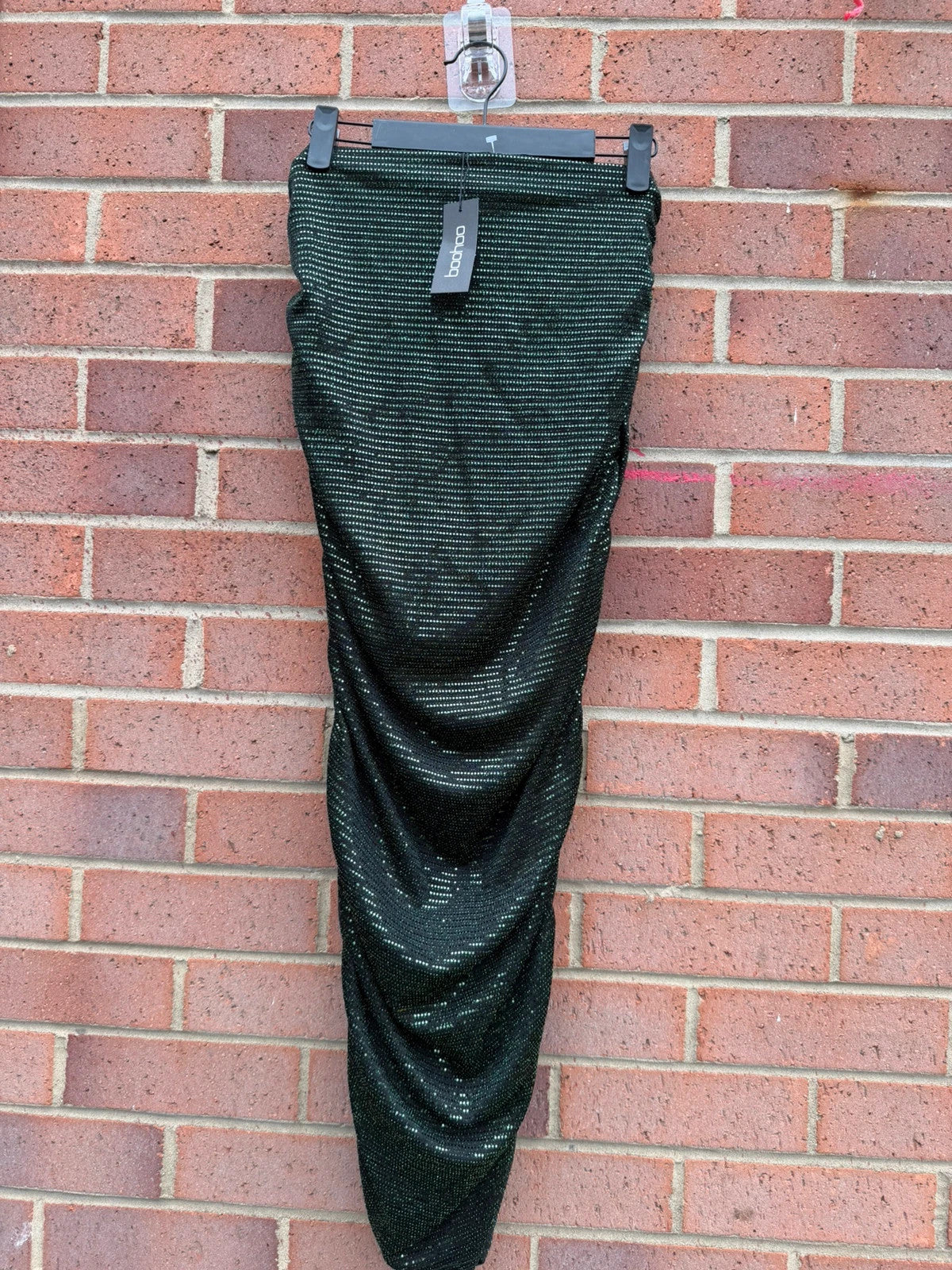 Boohoo green glitter midi skirt with ruched design and new with tags.