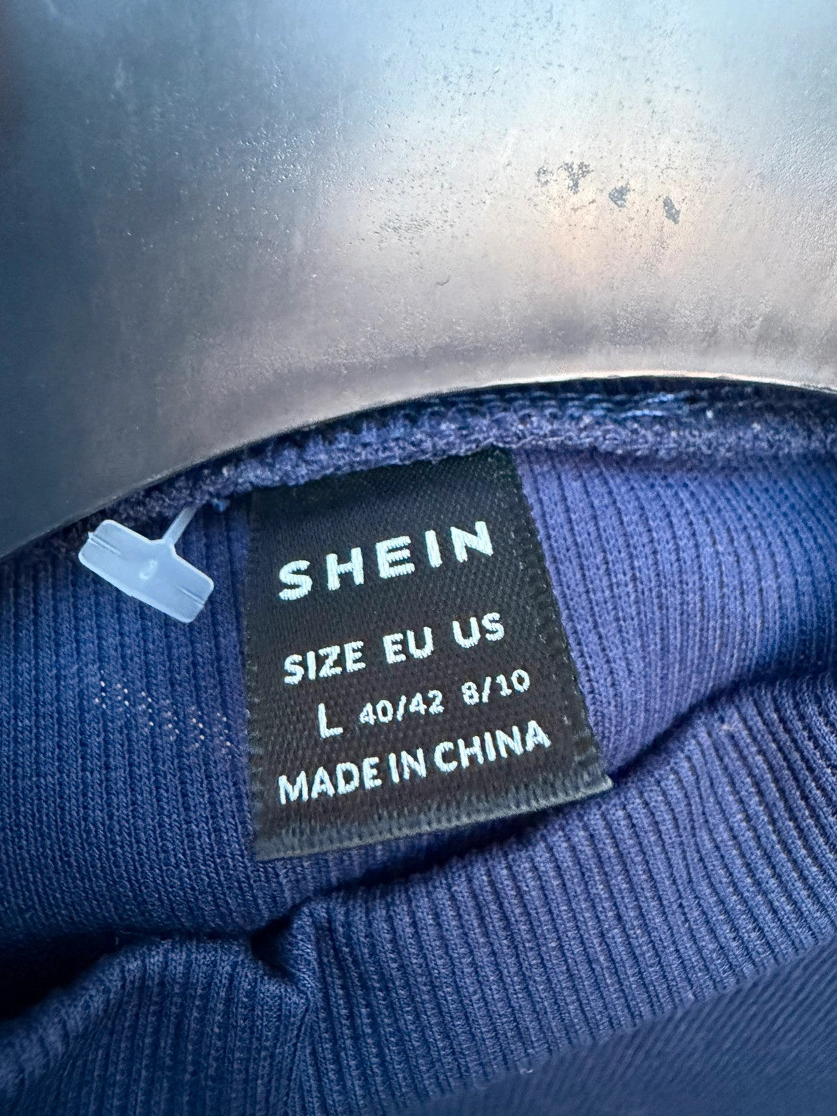 SHEIN navy ribbed high neck top with stretch fabric and minimalist design.