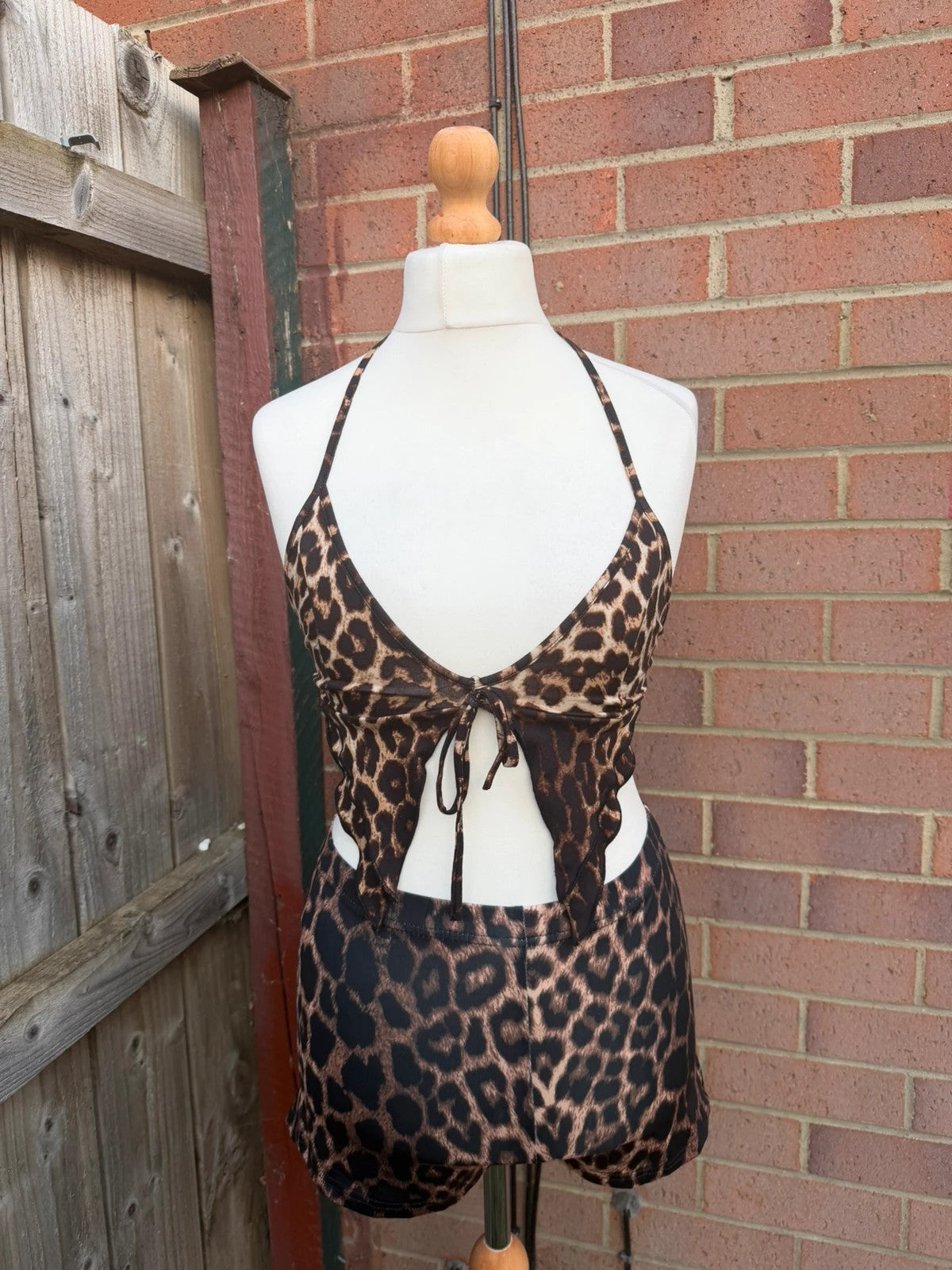 Y2K brown halterneck top with animal print pattern, pre-loved festival clubwear.