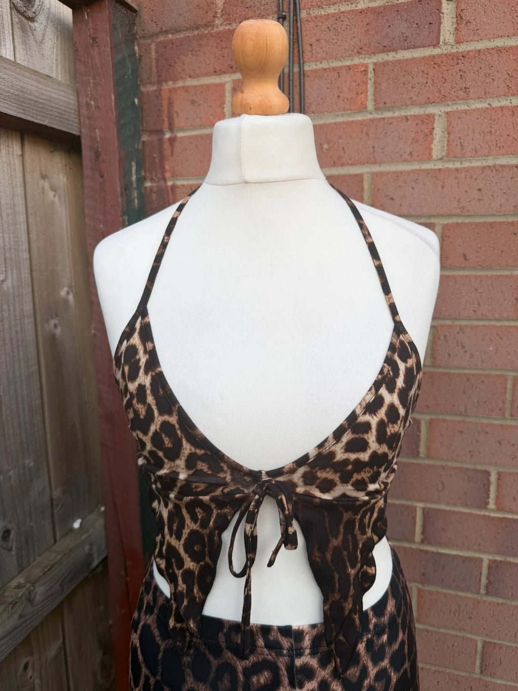 Y2K brown halterneck top with animal print pattern, pre-loved festival clubwear.