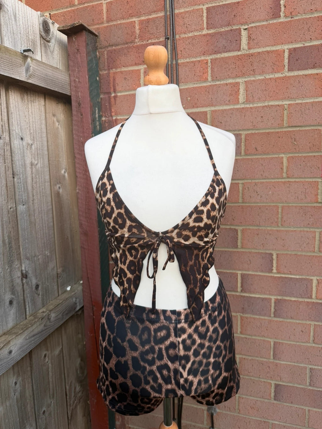 Y2K brown halterneck top with animal print pattern, pre-loved festival clubwear.