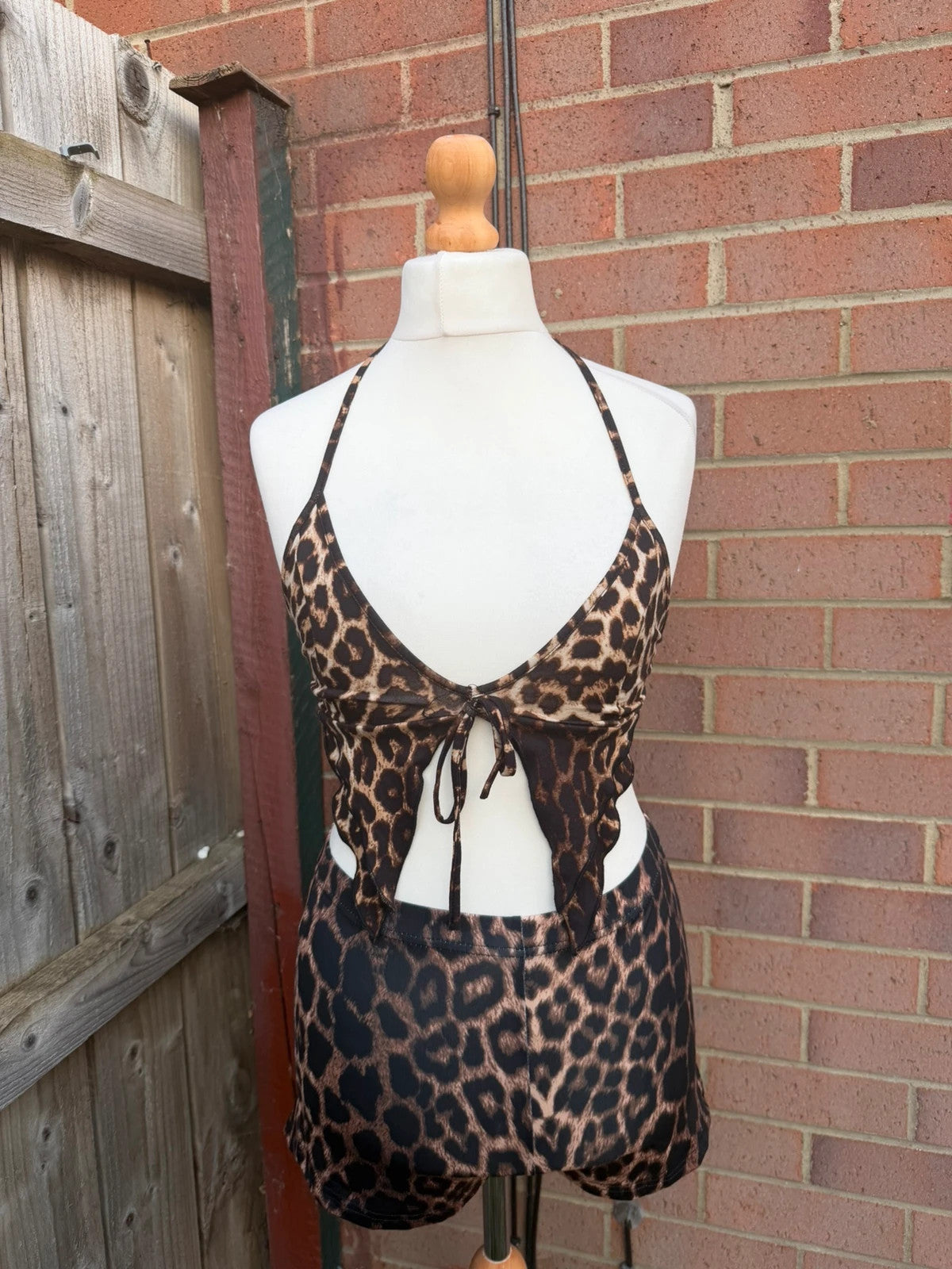 Y2K brown halterneck top with animal print pattern, pre-loved festival clubwear.