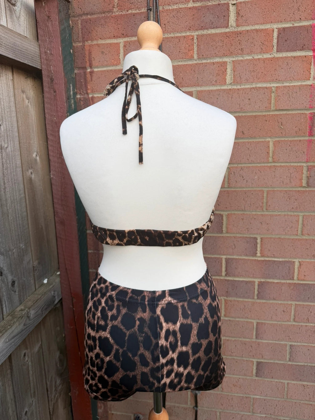 Y2K brown halterneck top with animal print pattern, pre-loved festival clubwear.