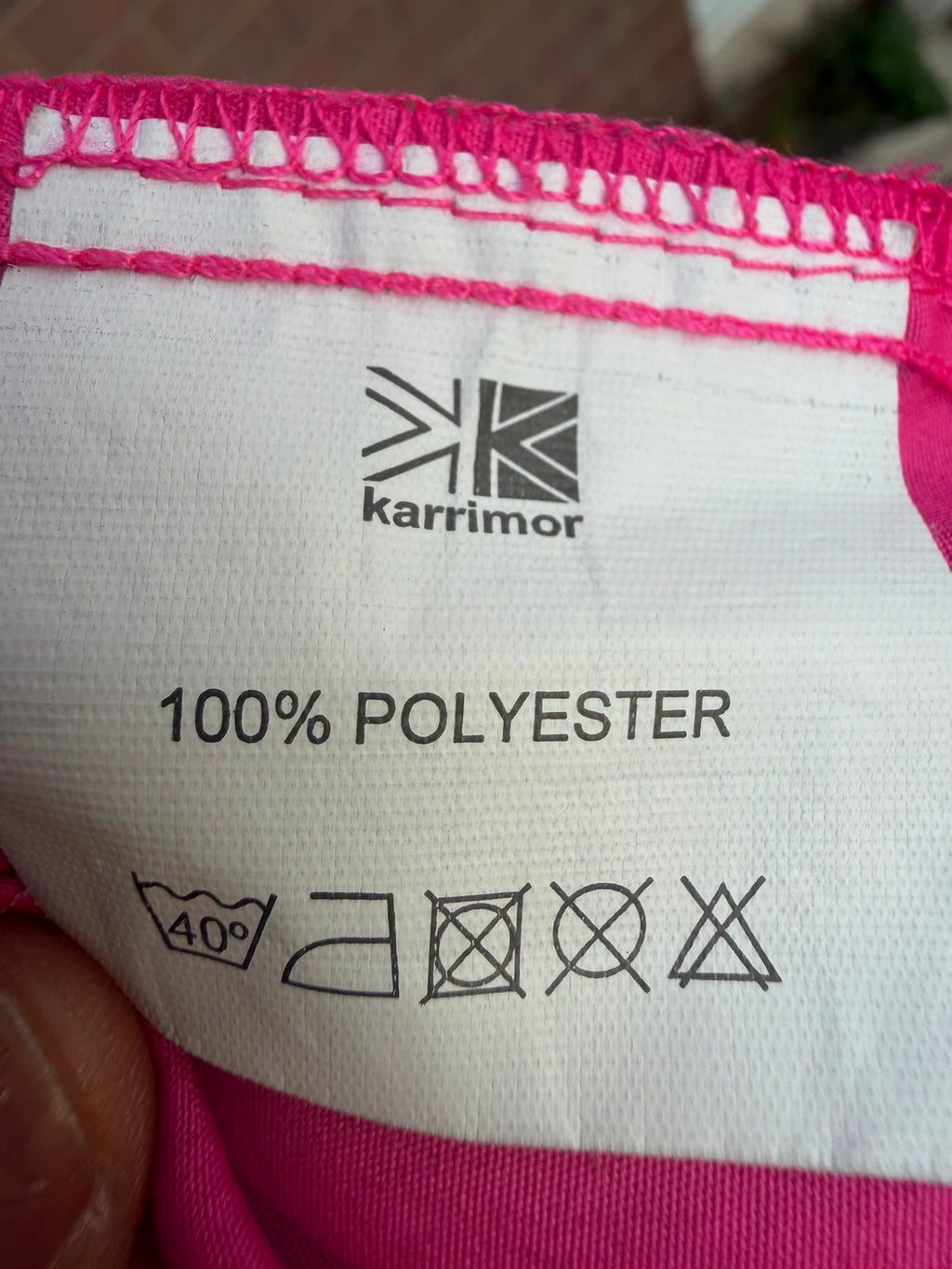 Karrimor pink ski suit zip-up with visible stain, perfect for gorpcore style.