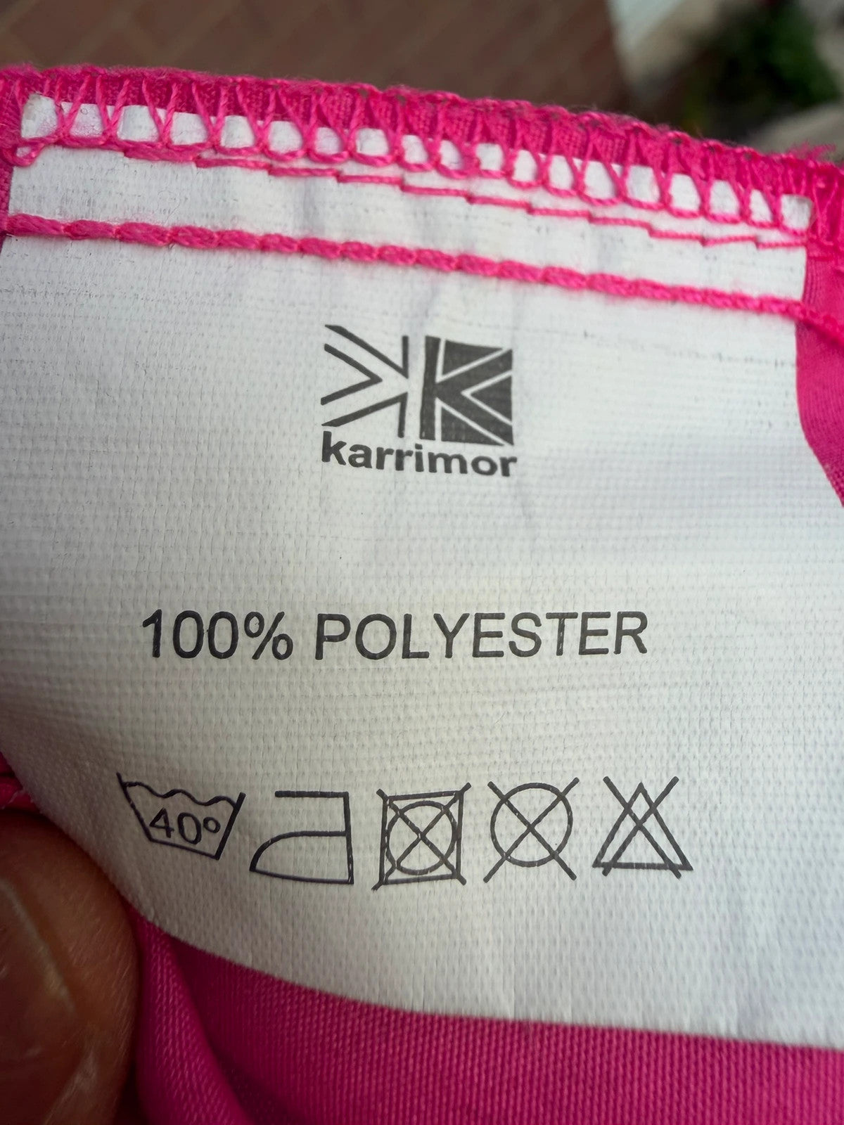 Karrimor pink ski suit zip-up with visible stain, perfect for gorpcore style.