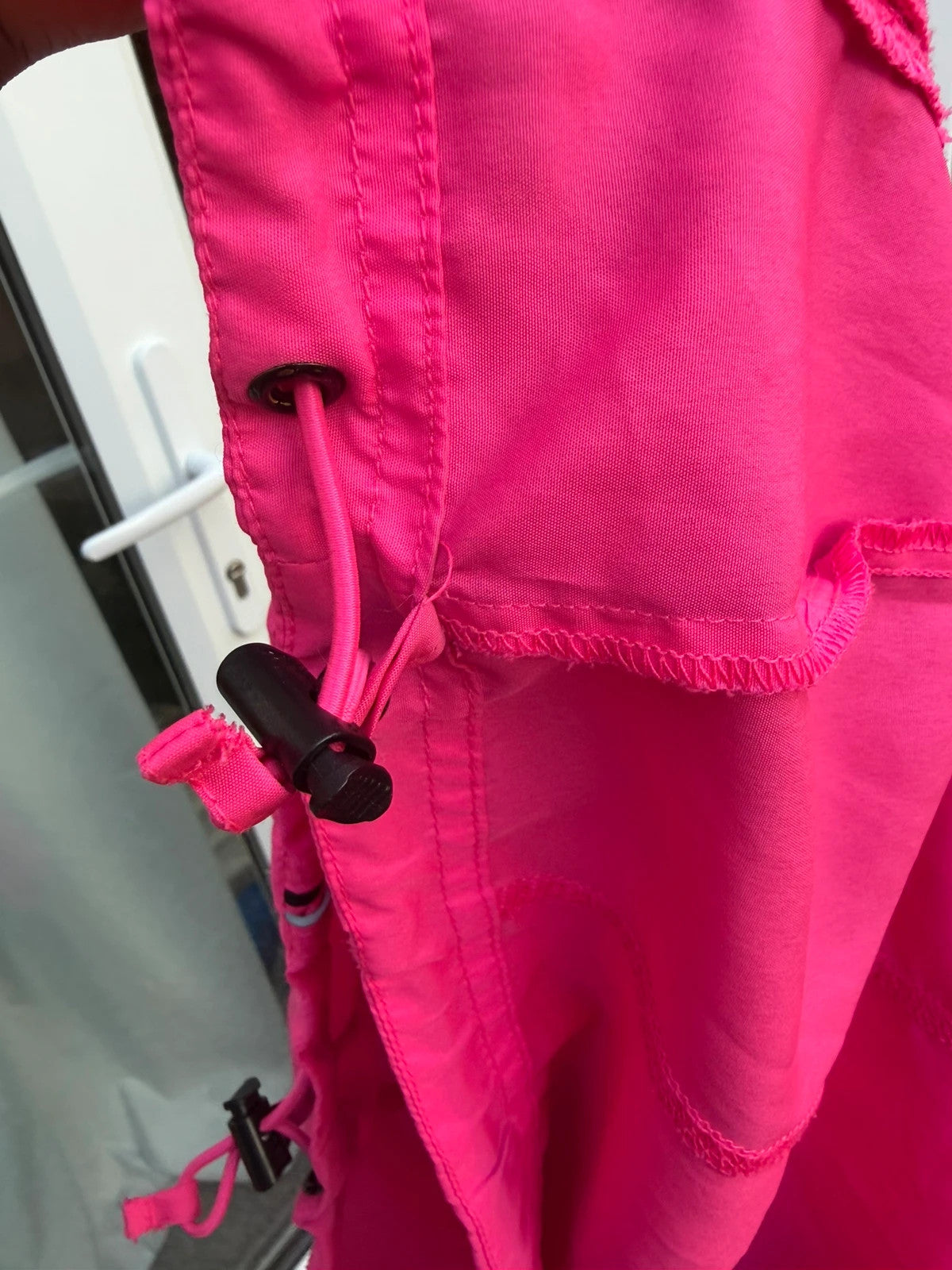 Karrimor pink ski suit zip-up with visible stain, perfect for gorpcore style.