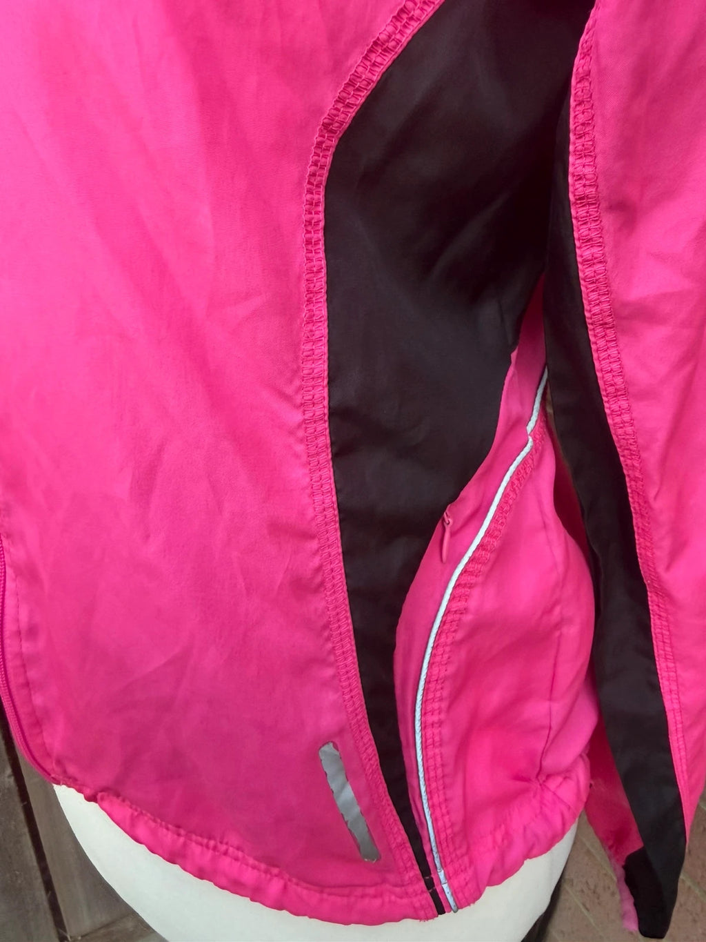 Karrimor pink ski suit zip-up with visible stain, perfect for gorpcore style.