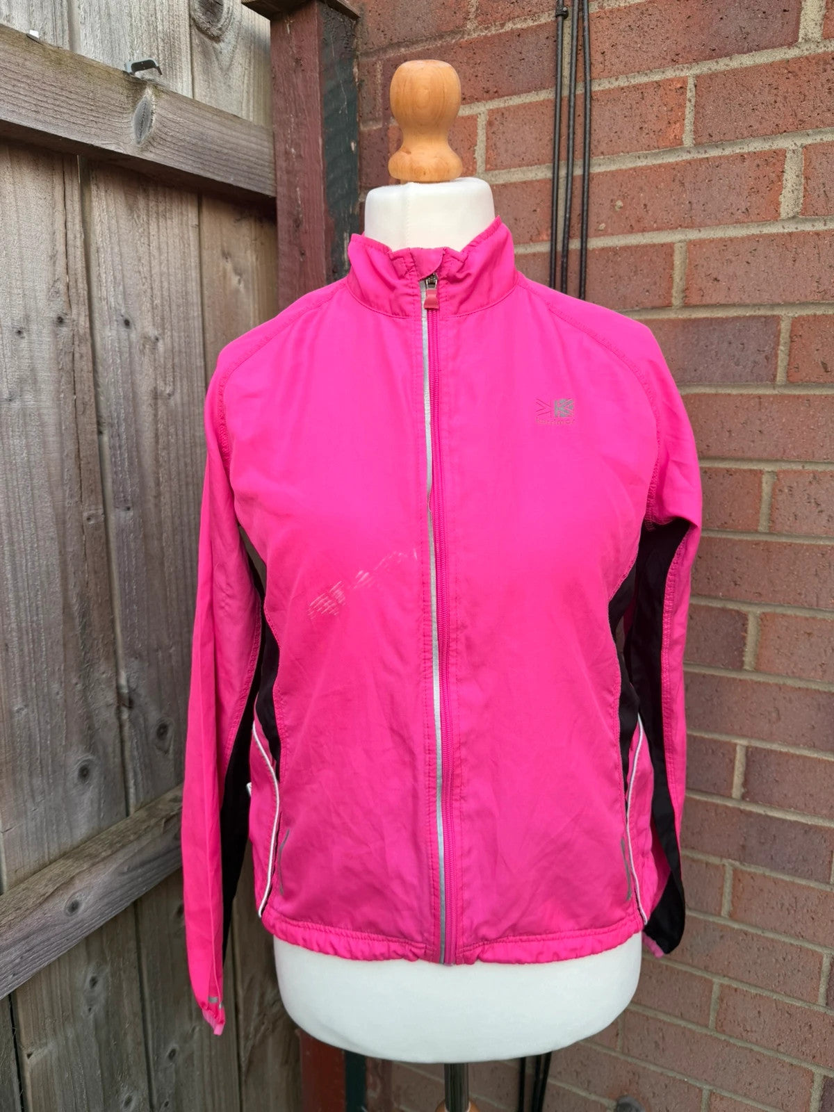 Karrimor pink ski suit zip-up with visible stain, perfect for gorpcore style.
