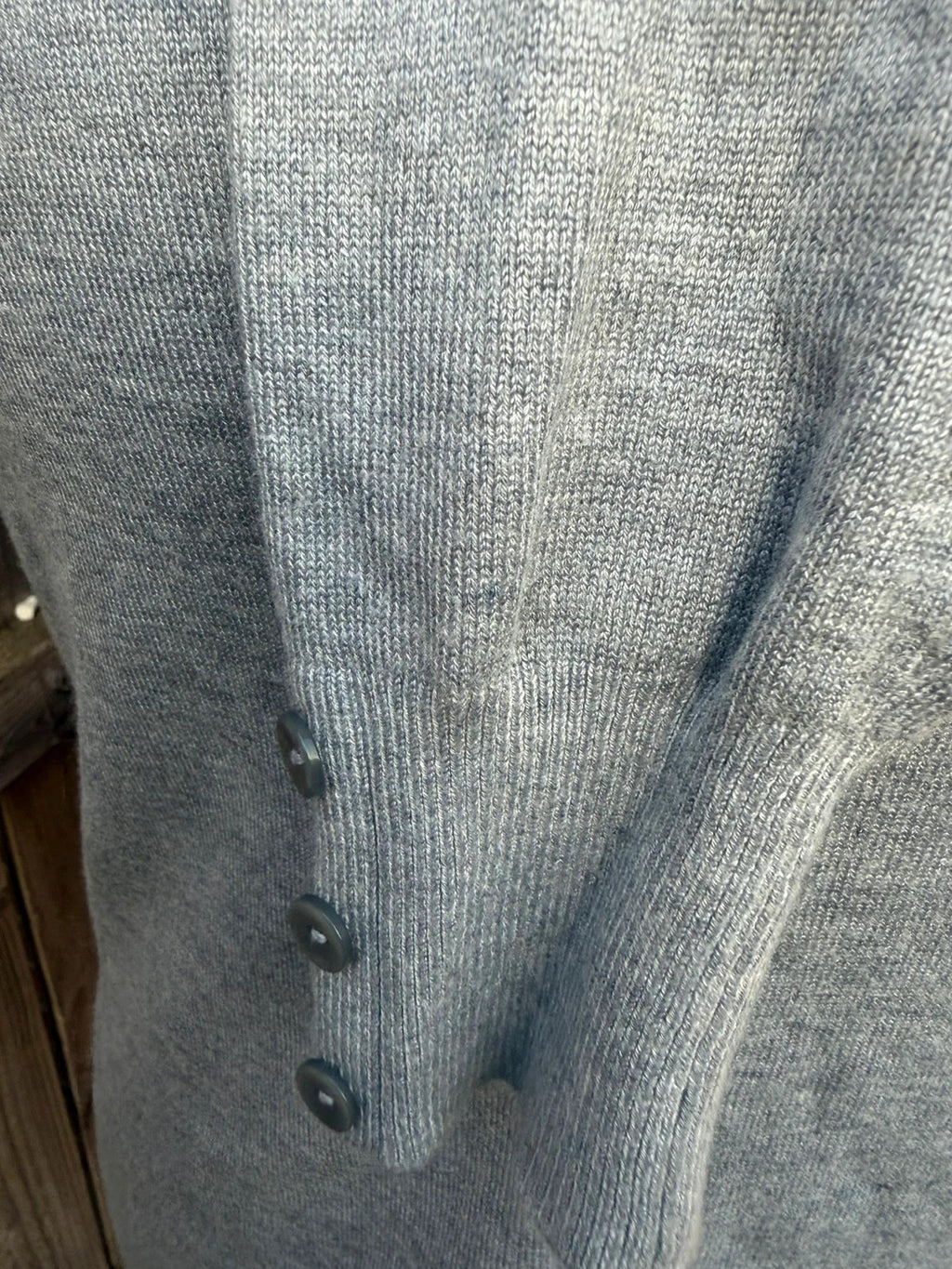 Papaya grey fine knit cardigan with button front and soft texture.