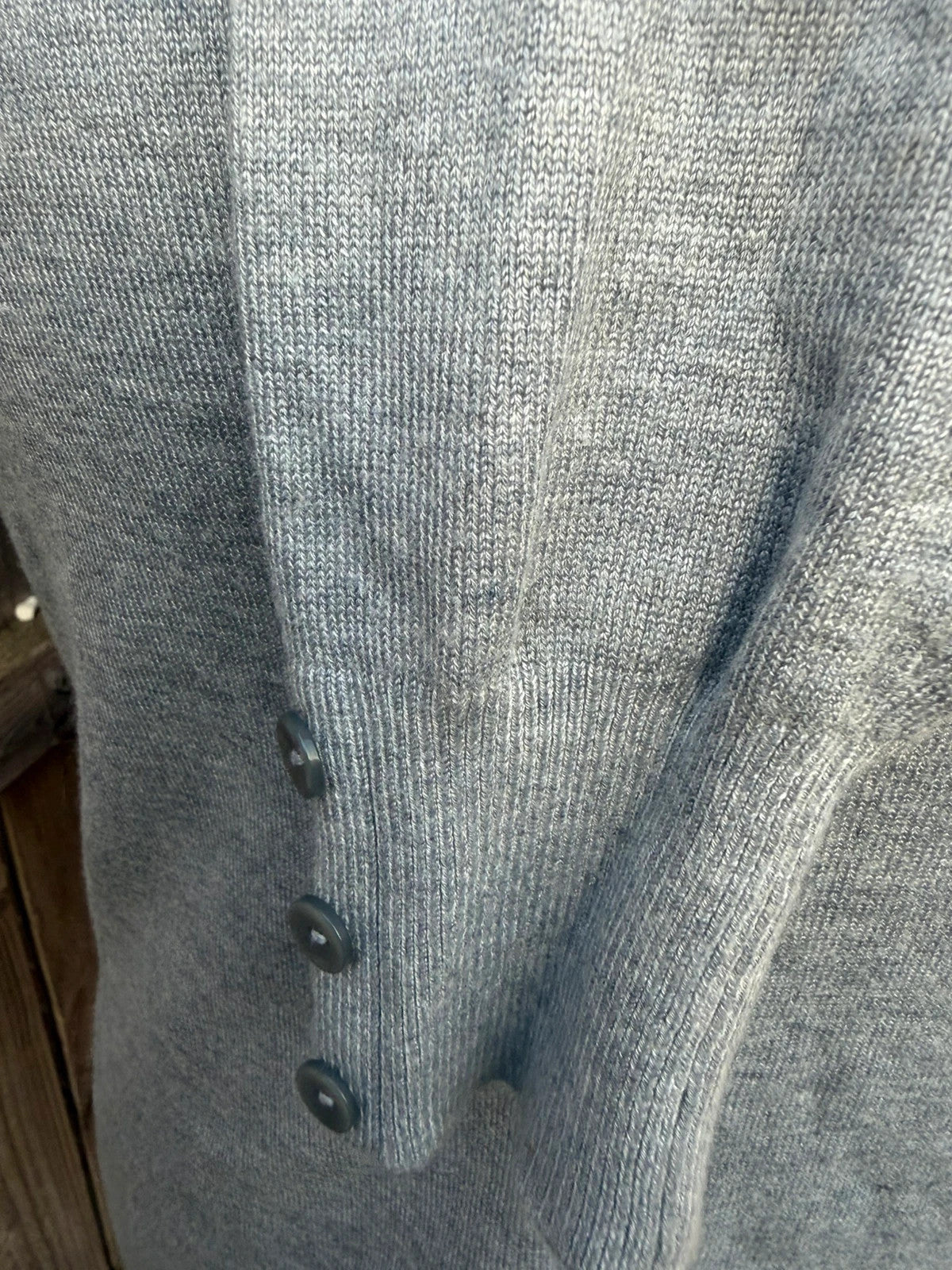 Papaya grey fine knit cardigan with button front and soft texture.
