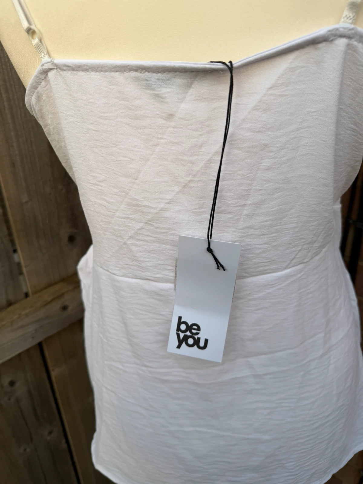 Be You white linen wrap mini dress with satin look and tags attached.