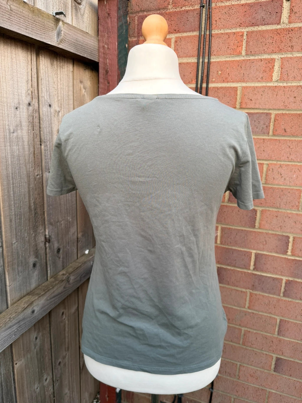 Basic grey pocket t-shirt with minimalist design and casual style.