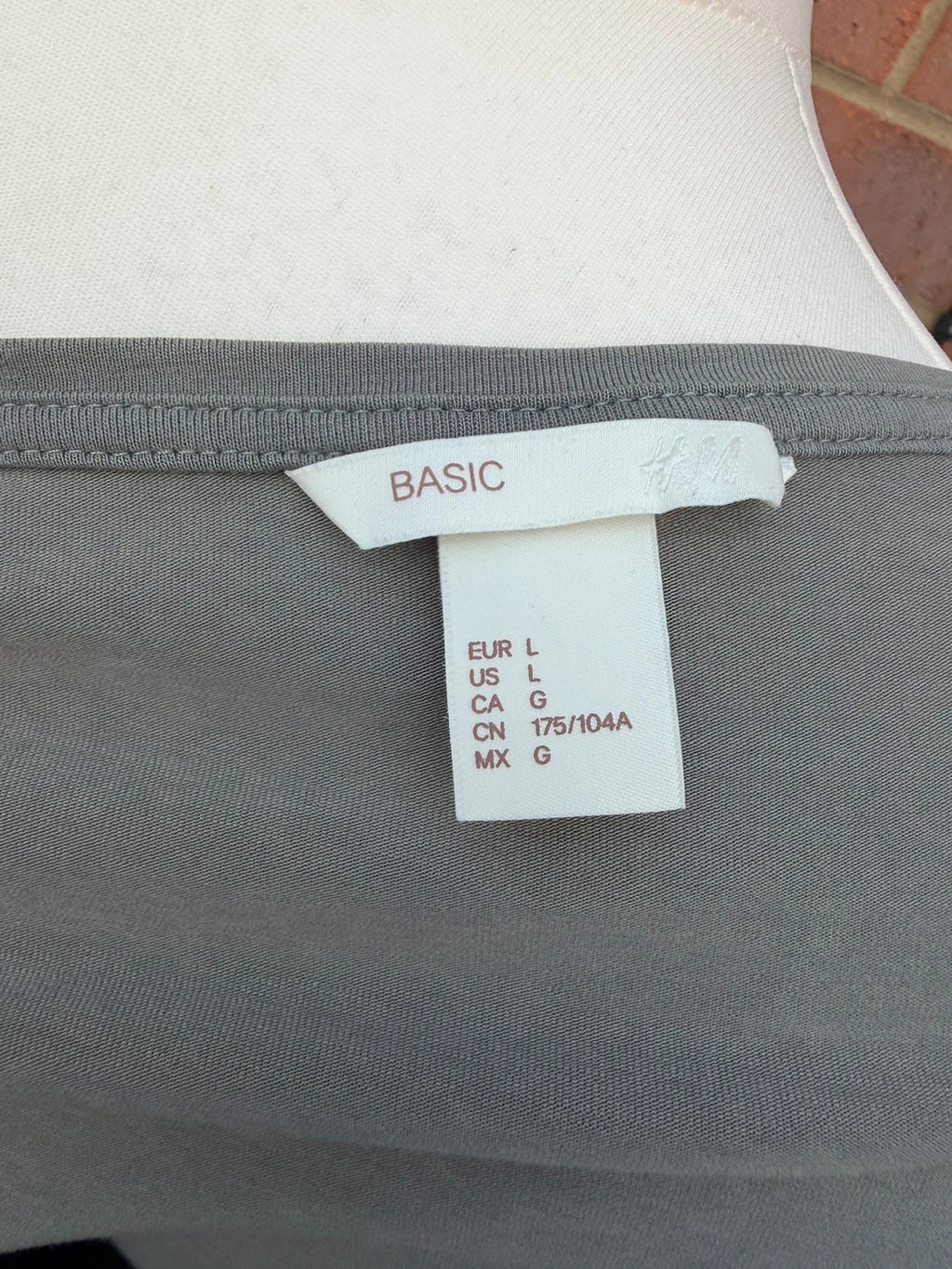 Basic grey pocket t-shirt with minimalist design and casual style.