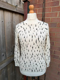 Jaeger black and white abstract print lightweight knit jumper with minimalist design.