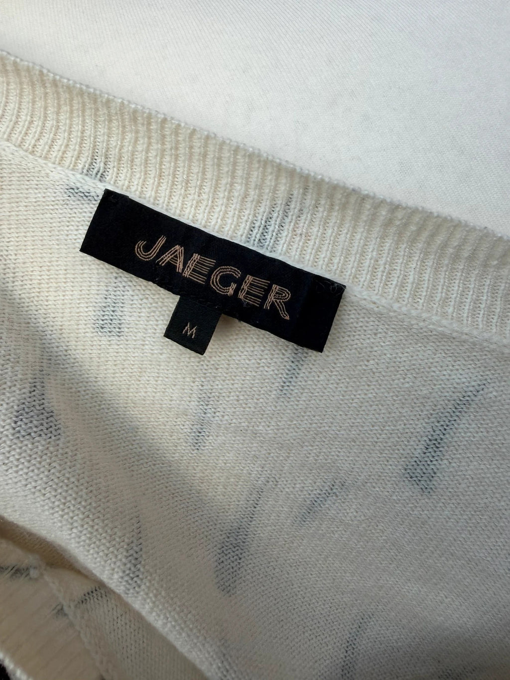 Jaeger black and white abstract print lightweight knit jumper with minimalist design.