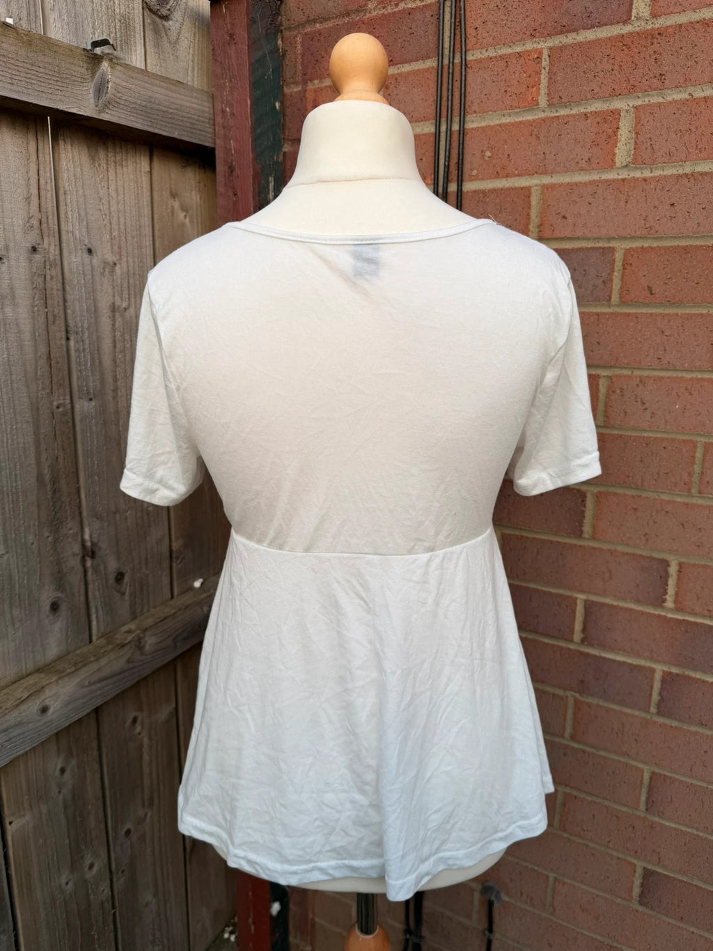 SHEIN white babydoll peplum tunic top with soft fabric and pocket detail.