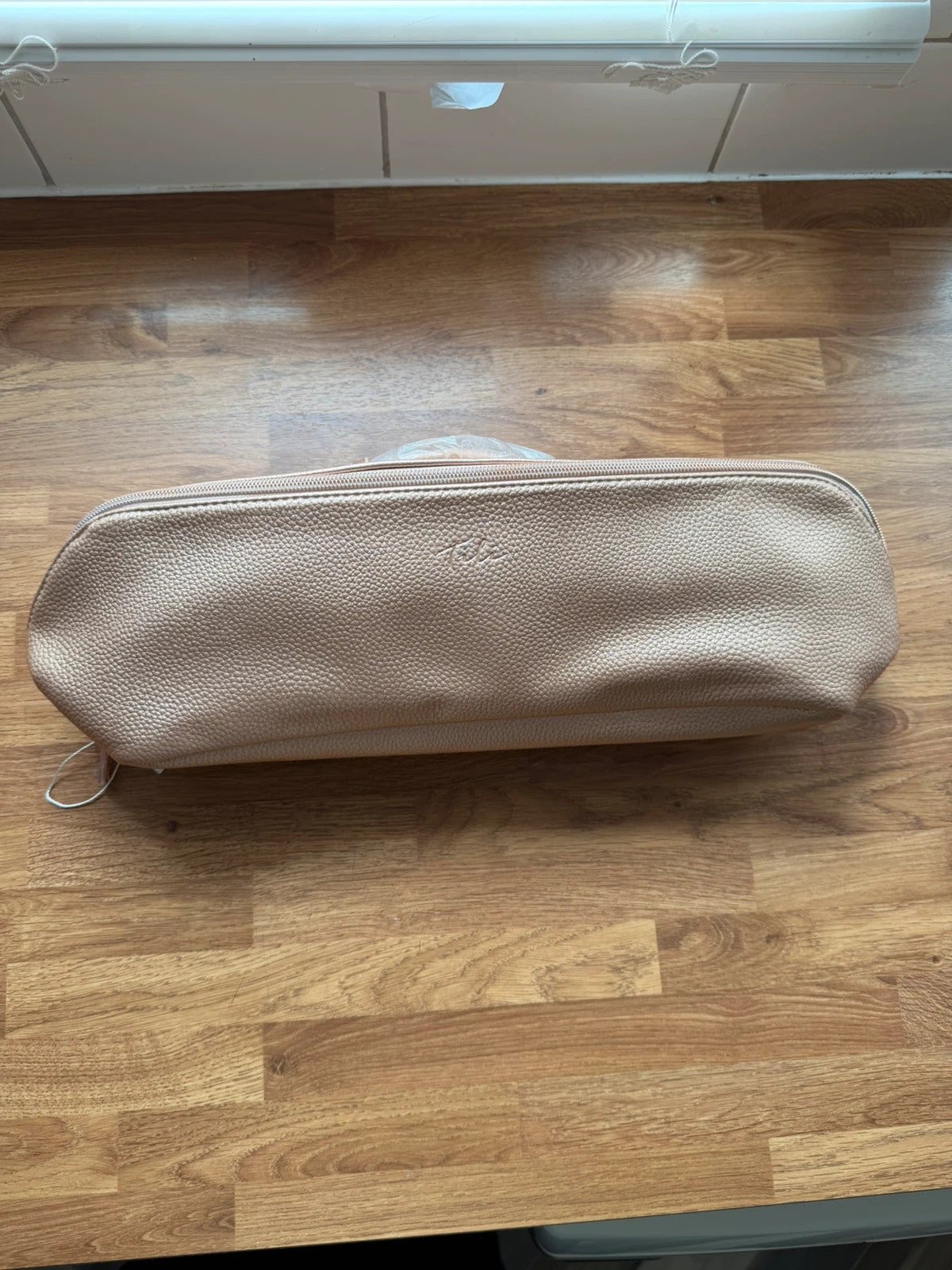 tili pink faux leather wig storage bag with zipper and tag details