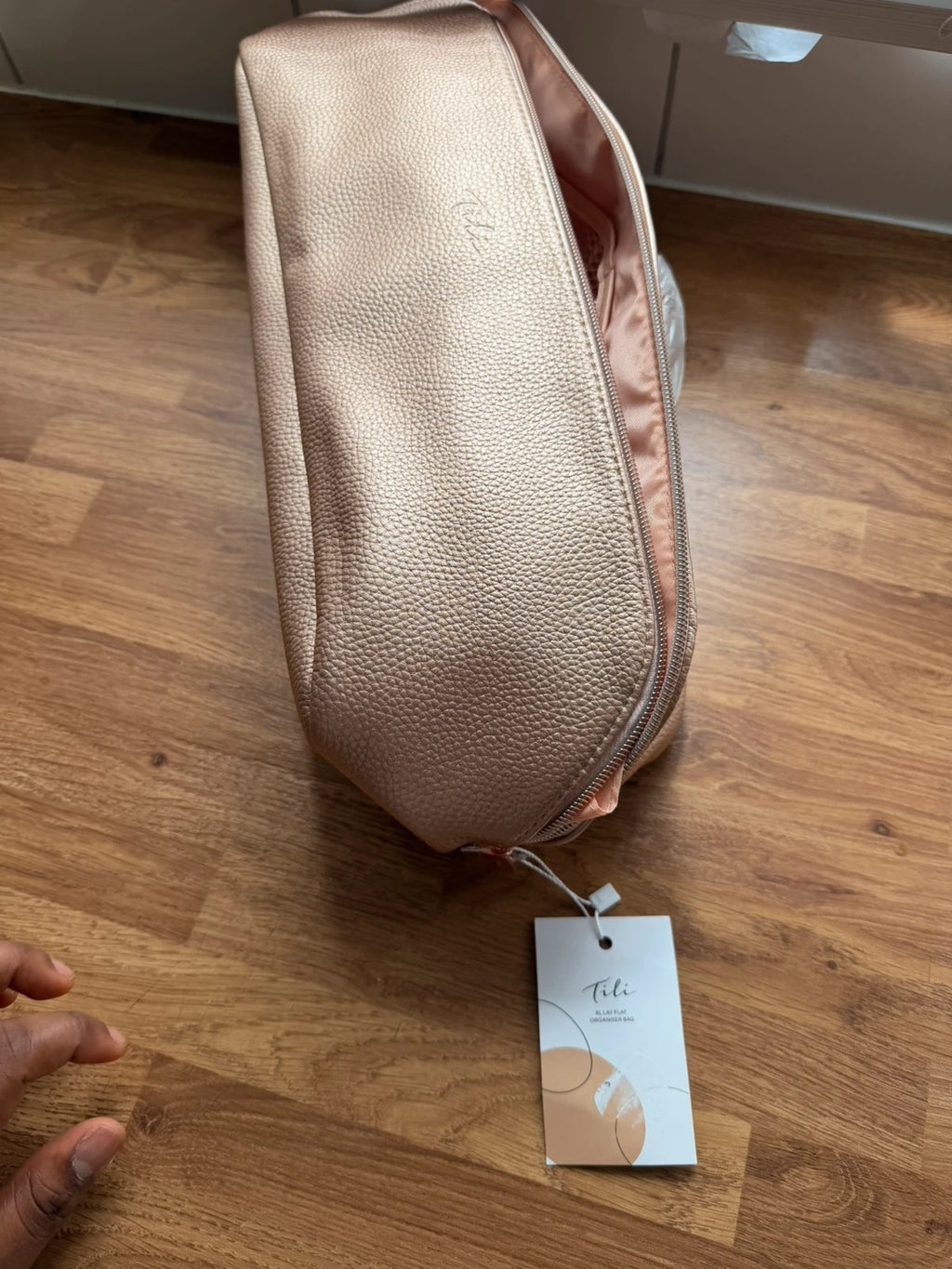 tili pink faux leather wig storage bag with zipper and tag details