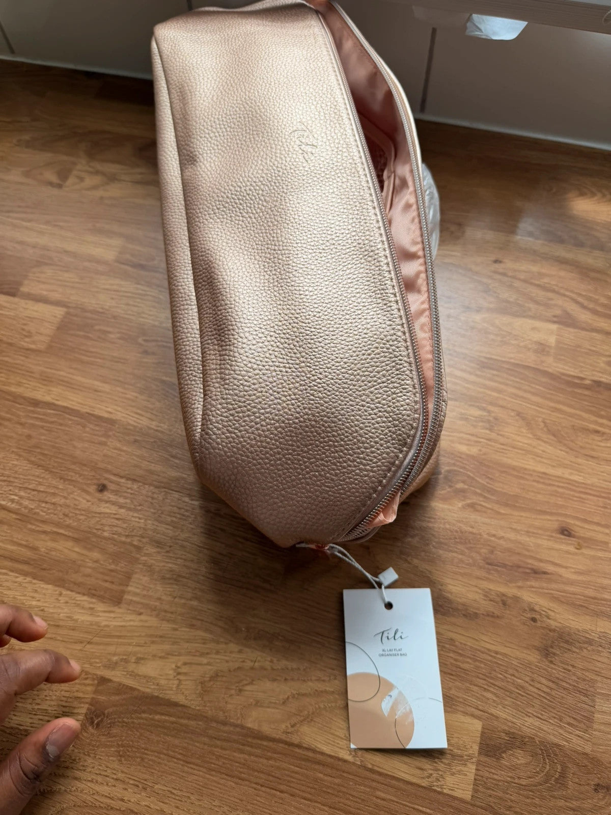 tili pink faux leather wig storage bag with zipper and tag details