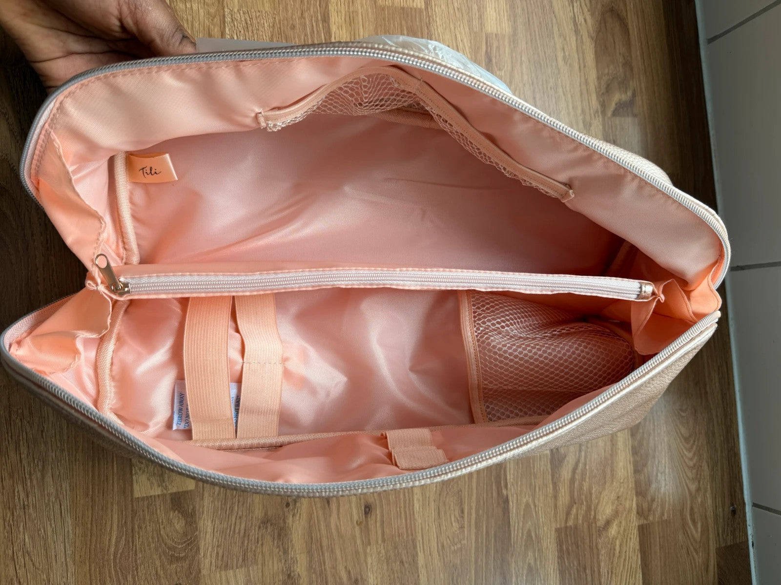 tili pink faux leather wig storage bag with zipper and tag details