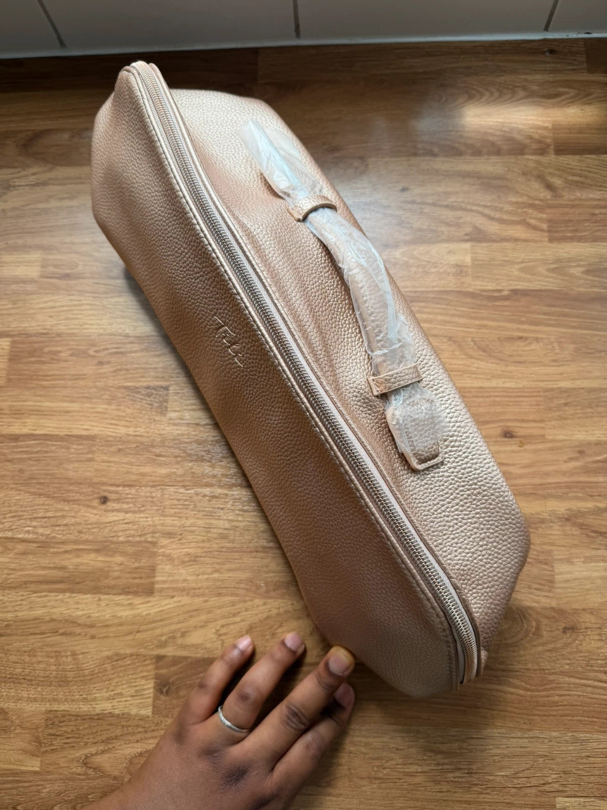 tili pink faux leather wig storage bag with zipper and tag details