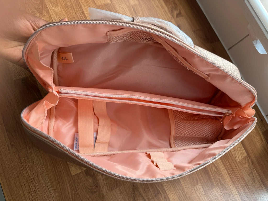 tili pink faux leather wig storage bag with zipper and tag details