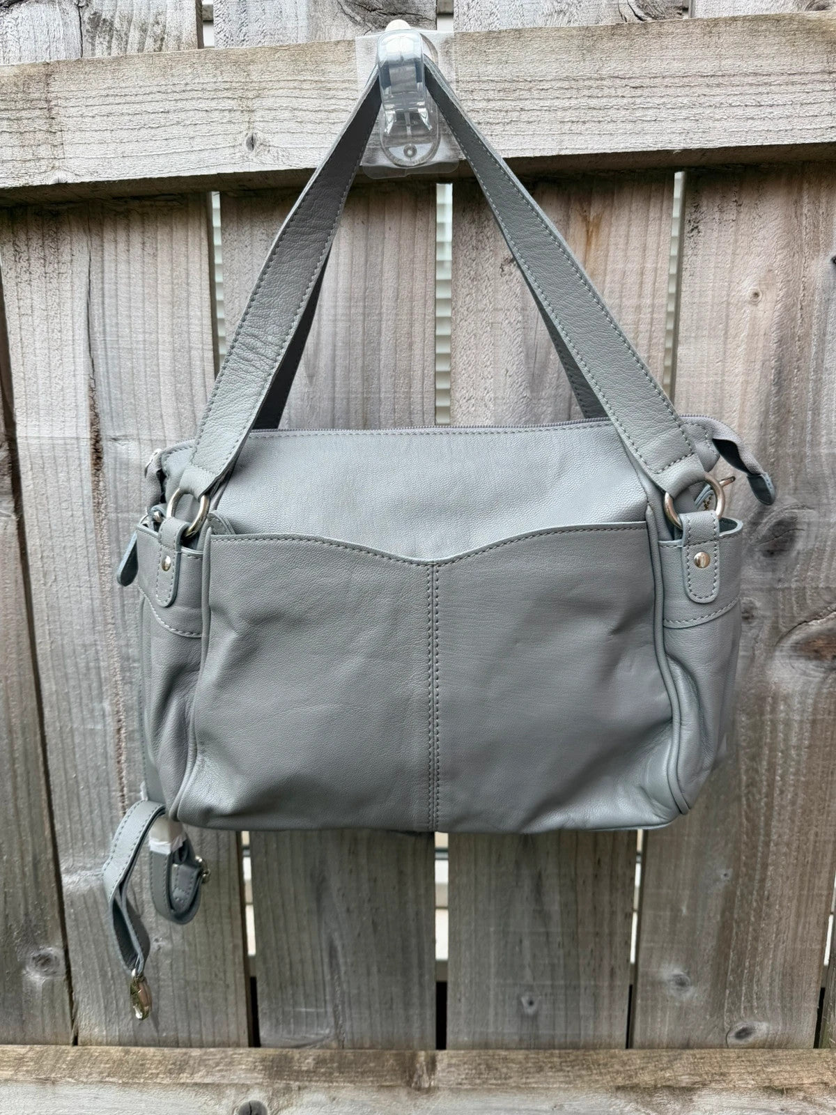Totes grey leather shoulder bag with minimalist design and new with tags.
