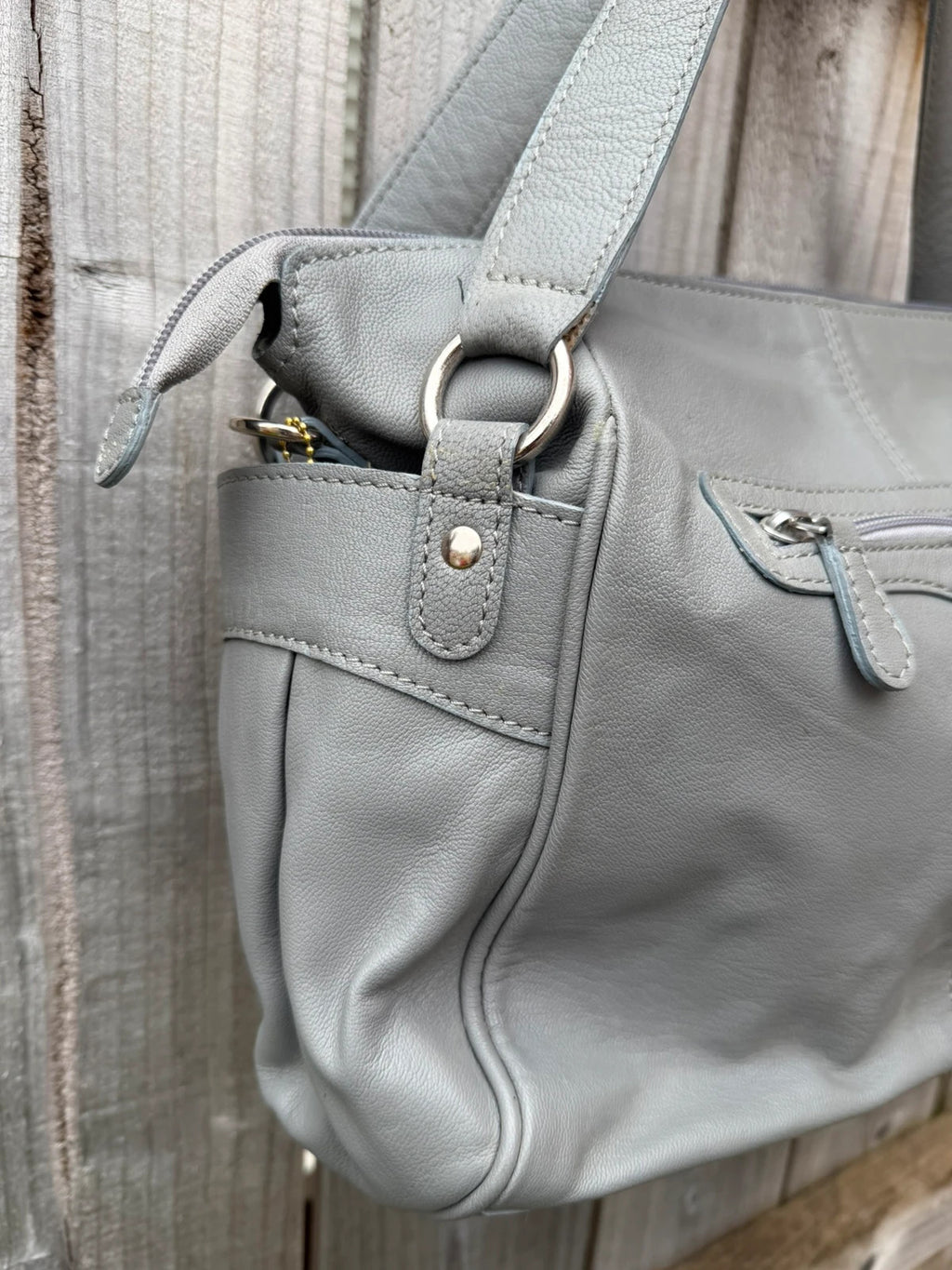 Totes grey leather shoulder bag with minimalist design and new with tags.