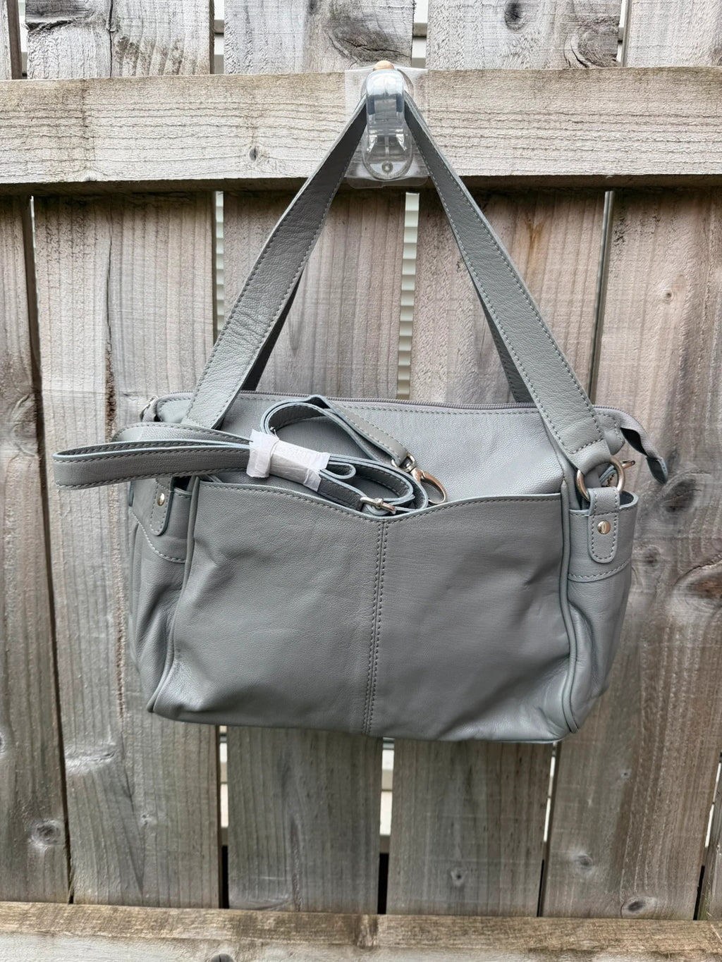 Totes grey leather shoulder bag with minimalist design and new with tags.