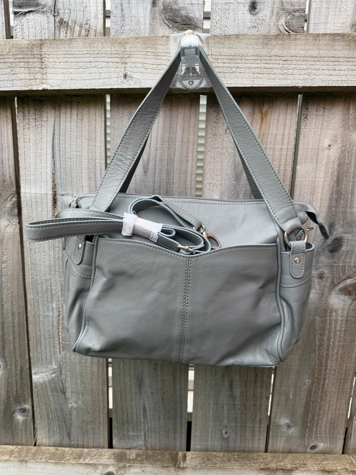 Totes grey leather shoulder bag with minimalist design and new with tags.