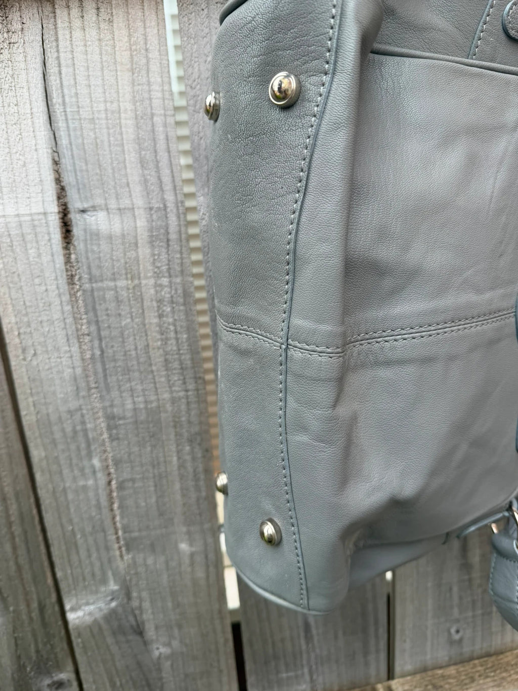 Totes grey leather shoulder bag with minimalist design and new with tags.