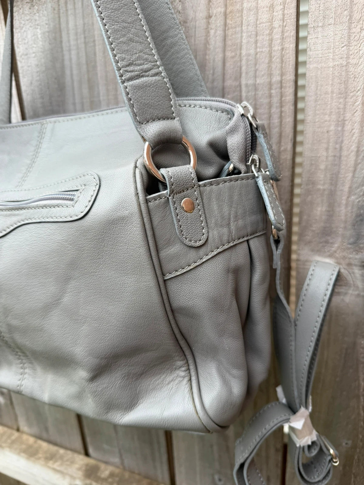 Totes grey leather shoulder bag with minimalist design and new with tags.