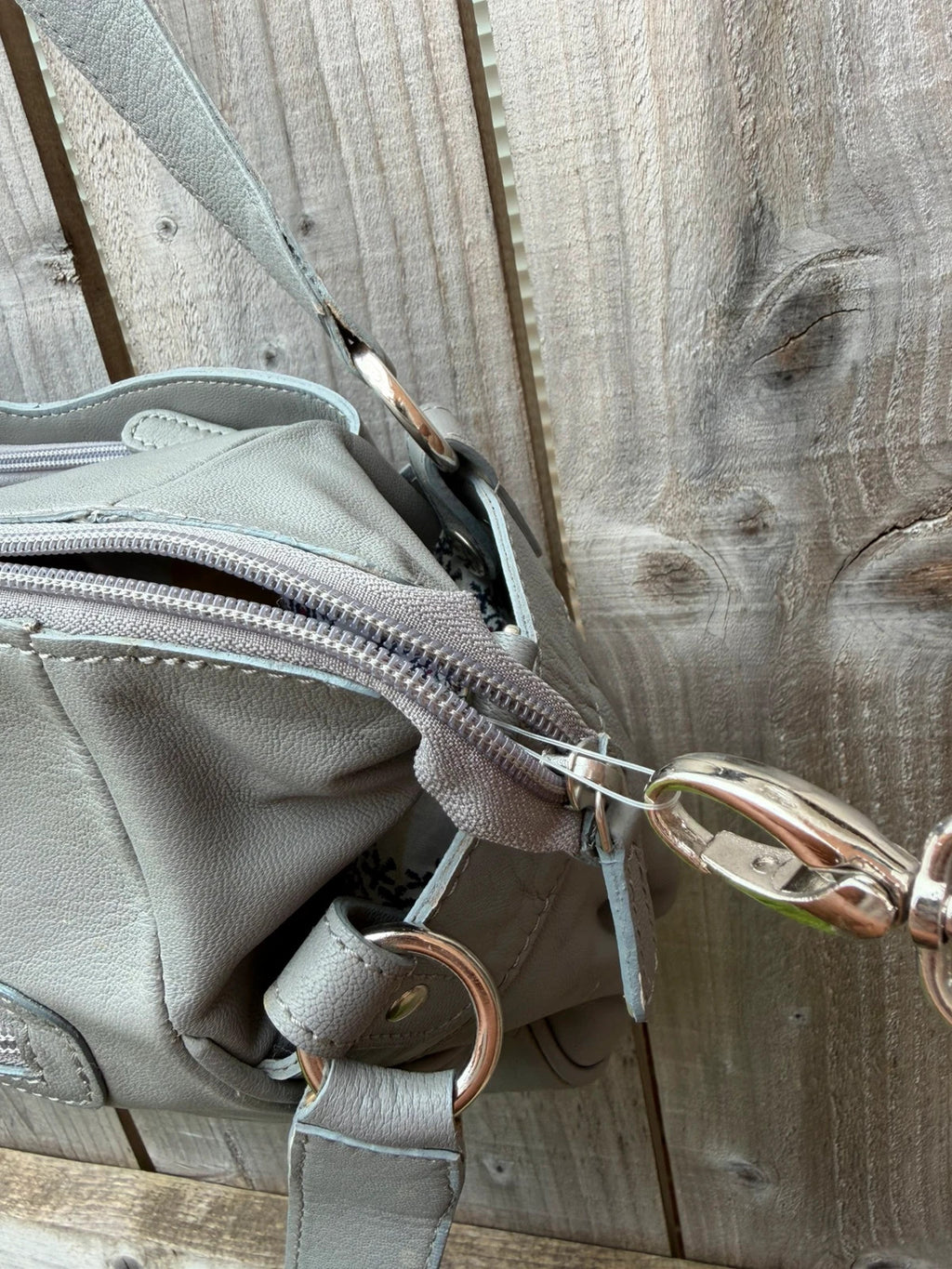 Totes grey leather shoulder bag with minimalist design and new with tags.